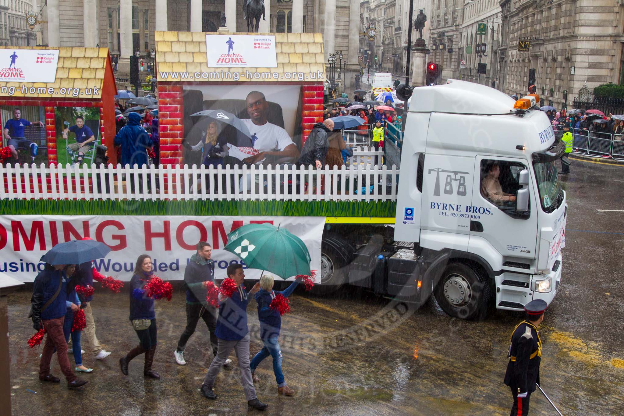 Lord Mayor's Show 2013: 92- Coming Home- is the fundraising campaign for the Haig Housing Trust, which provides housing help for severely wounded heroes.Kindly sponsored by Knight Frank..
Press stand opposite Mansion House, City of London,
London,
Greater London,
United Kingdom,
on 09 November 2013 at 11:50, image #1118