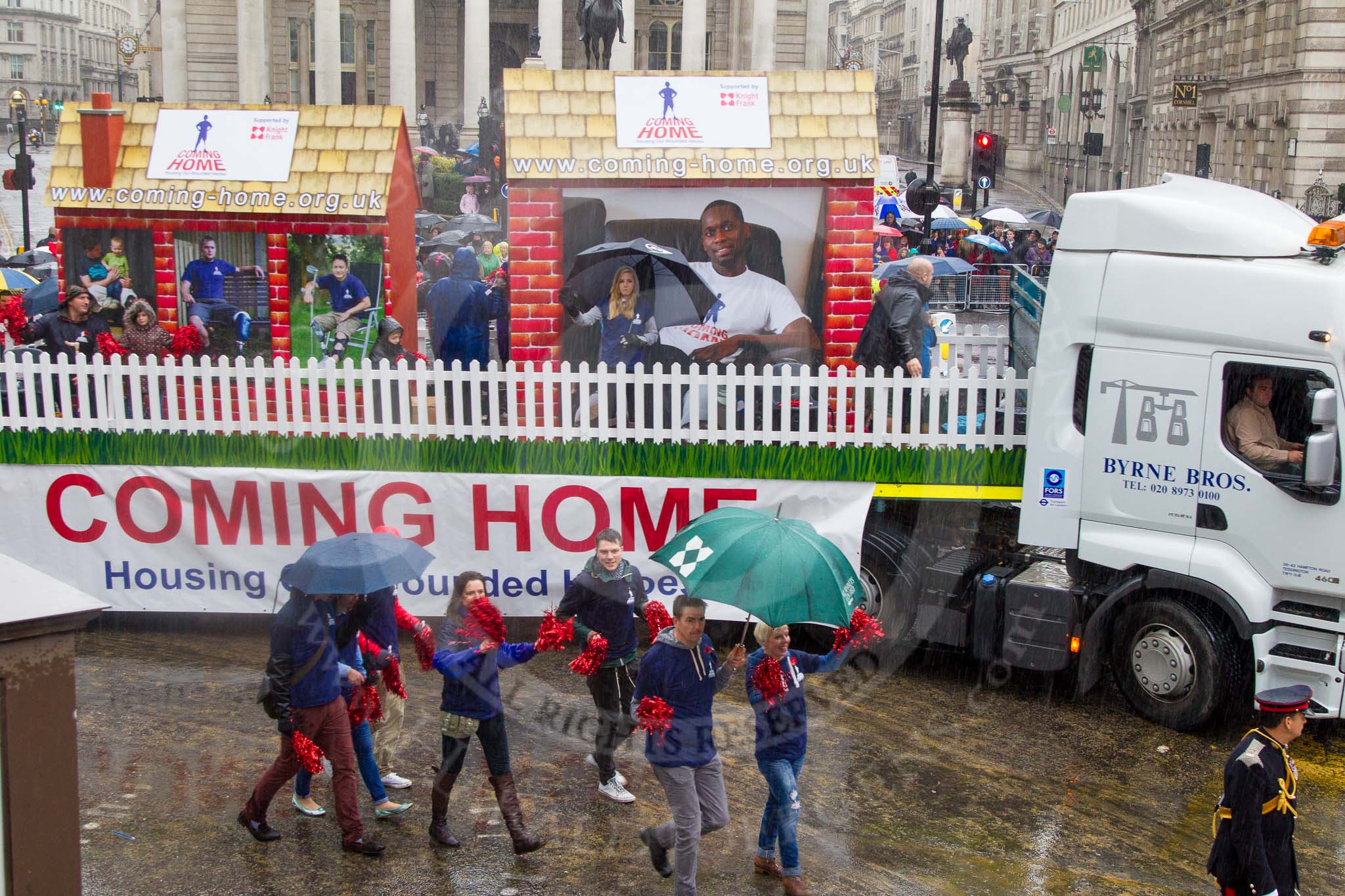 Lord Mayor's Show 2013: 92- Coming Home- is the fundraising campaign for the Haig Housing Trust, which provides housing help for severely wounded heroes.Kindly sponsored by Knight Frank..
Press stand opposite Mansion House, City of London,
London,
Greater London,
United Kingdom,
on 09 November 2013 at 11:50, image #1119