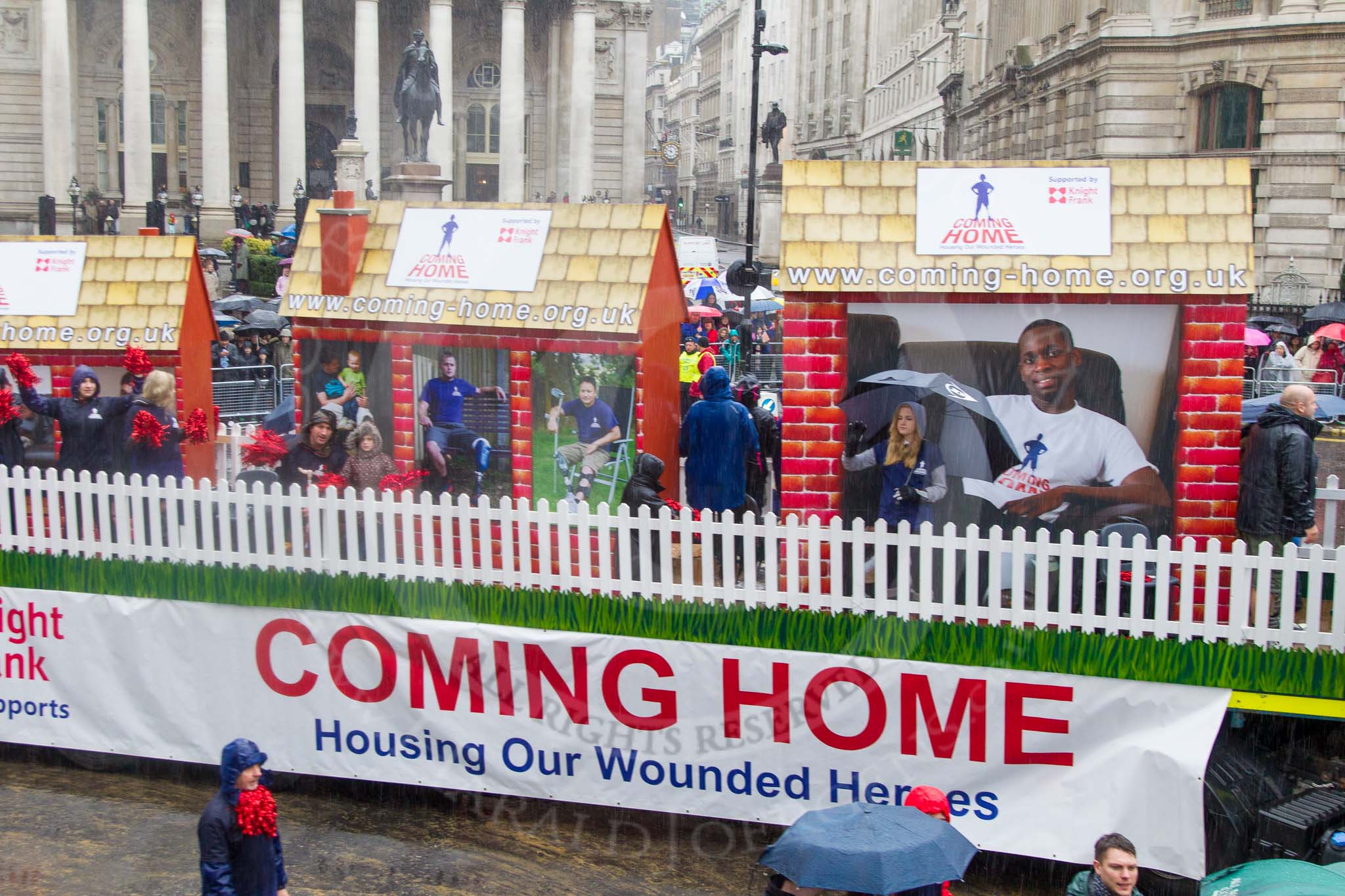 Lord Mayor's Show 2013: 92- Coming Home- is the fundraising campaign for the Haig Housing Trust, which provides housing help for severely wounded heroes.Kindly sponsored by Knight Frank..
Press stand opposite Mansion House, City of London,
London,
Greater London,
United Kingdom,
on 09 November 2013 at 11:50, image #1120