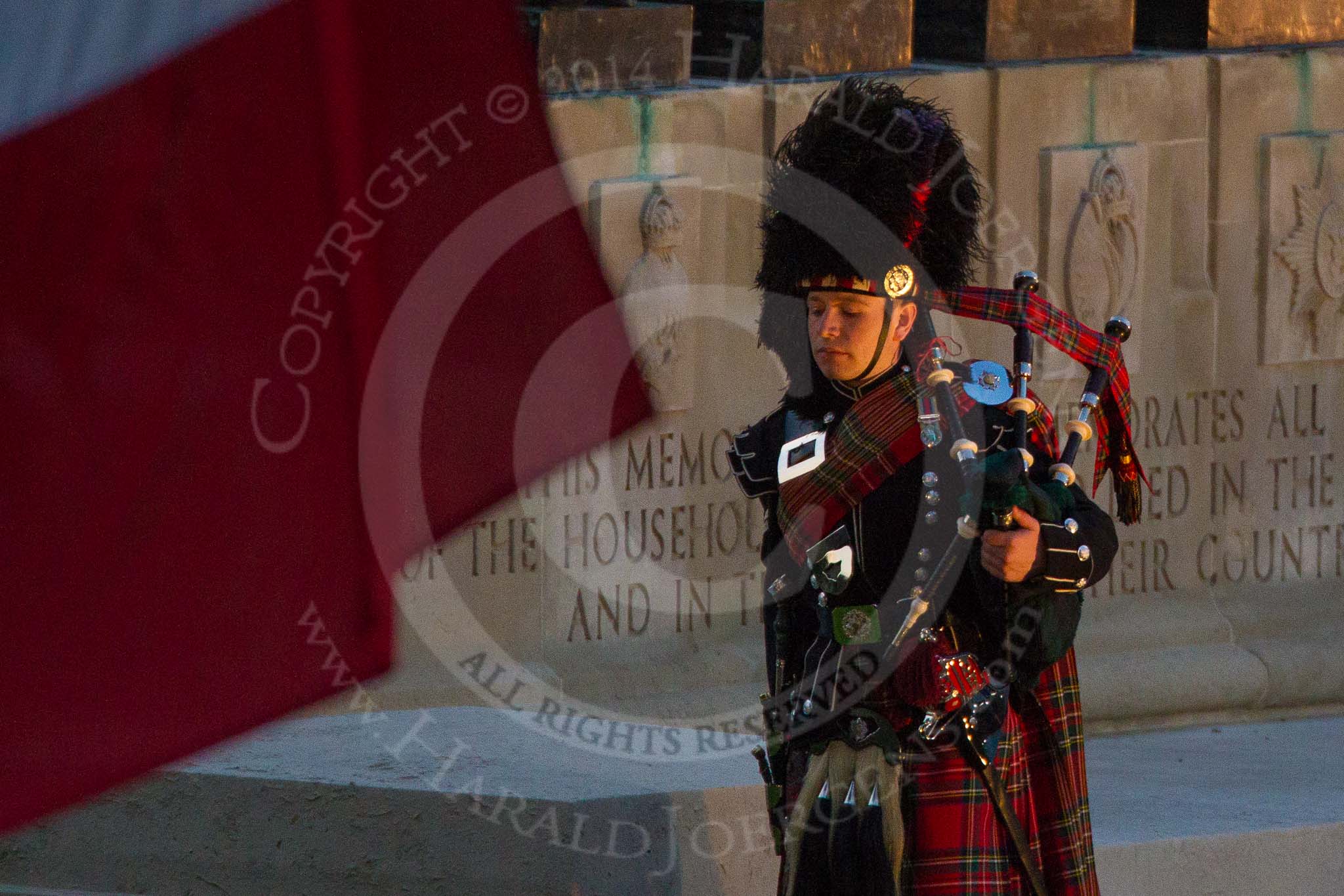 Beating Retreat 2014: The lone piper, playing "Lord Lovetts Lament" at the Guards Memorial - Lance Corporal James Bell, 1st Battalion Scots Guards, F Company Scots Guards' piper..
Horse Guards Parade, Westminster,
London SW1A,

United Kingdom,
on 11 June 2014 at 21:12, image #289