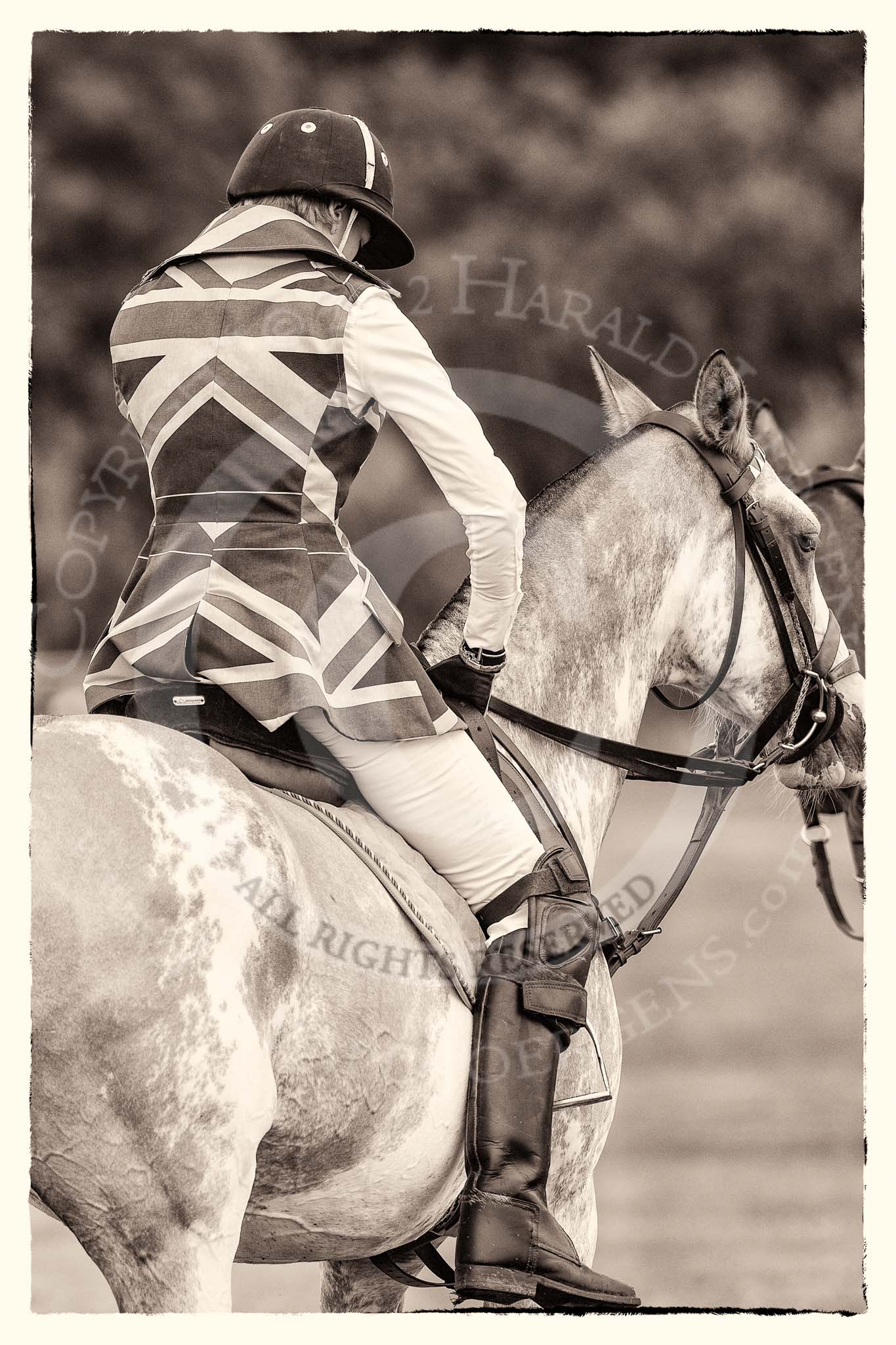 7th Heritage Polo Cup semi-finals: Leigh Fisher fixing her stirrup for the next chukker - Ladies of the British Empire, Liberty Freedom..
Hurtwood Park Polo Club,
Ewhurst Green,
Surrey,
United Kingdom,
on 04 August 2012 at 13:22, image #133