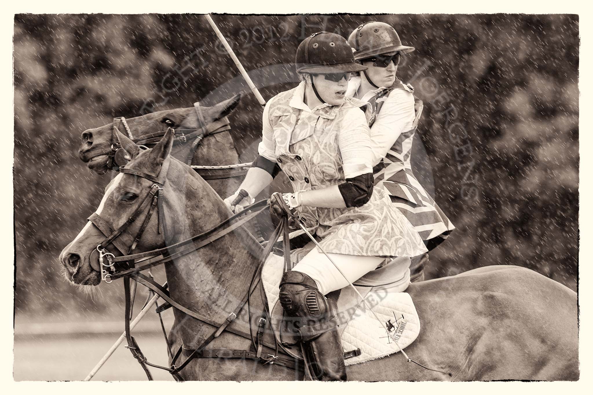 7th Heritage Polo Cup semi-finals: Heloise Lorentzen (1) GB/BRA looking back to receive the ball of the  Amazons of Polo, beside Sarah Wisman Ladies of the British Empire Liberty Freedom..
Hurtwood Park Polo Club,
Ewhurst Green,
Surrey,
United Kingdom,
on 04 August 2012 at 13:28, image #135