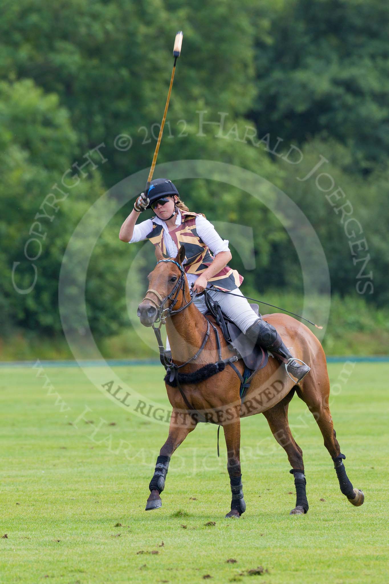 7th Heritage Polo Cup semi-finals: Rosie Ross executing the penalty in favour of the Ladies of the British Empire Polo Team..
Hurtwood Park Polo Club,
Ewhurst Green,
Surrey,
United Kingdom,
on 04 August 2012 at 13:33, image #150