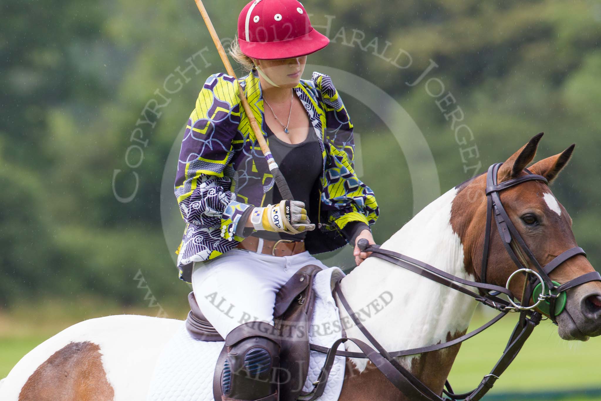 7th Heritage Polo Cup semi-finals: Sophie Kyriazy wearing Nigerian Fashion Design DZNY sponsored by AMG PETROENERGY..
Hurtwood Park Polo Club,
Ewhurst Green,
Surrey,
United Kingdom,
on 04 August 2012 at 13:36, image #164