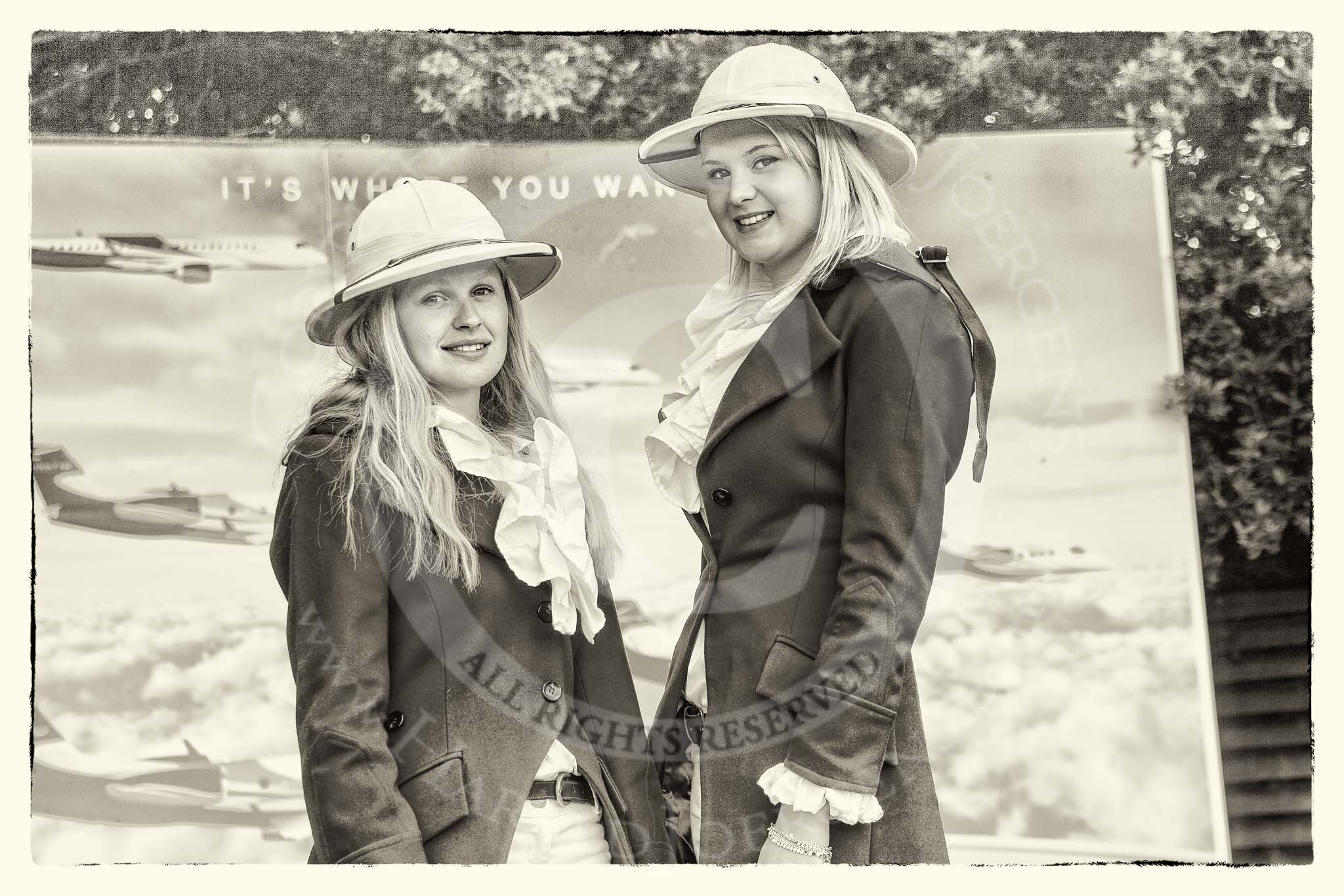 7th Heritage Polo Cup finals: Liberty Freedom Sandhurst Red Coats & Ascot Top Hats Pith Helmets worn by Camilla Lovegrove and Serena Lillington-Price at the Entrance of  Hurtwood Park Polo Club..
Hurtwood Park Polo Club,
Ewhurst Green,
Surrey,
United Kingdom,
on 05 August 2012 at 11:58, image #3