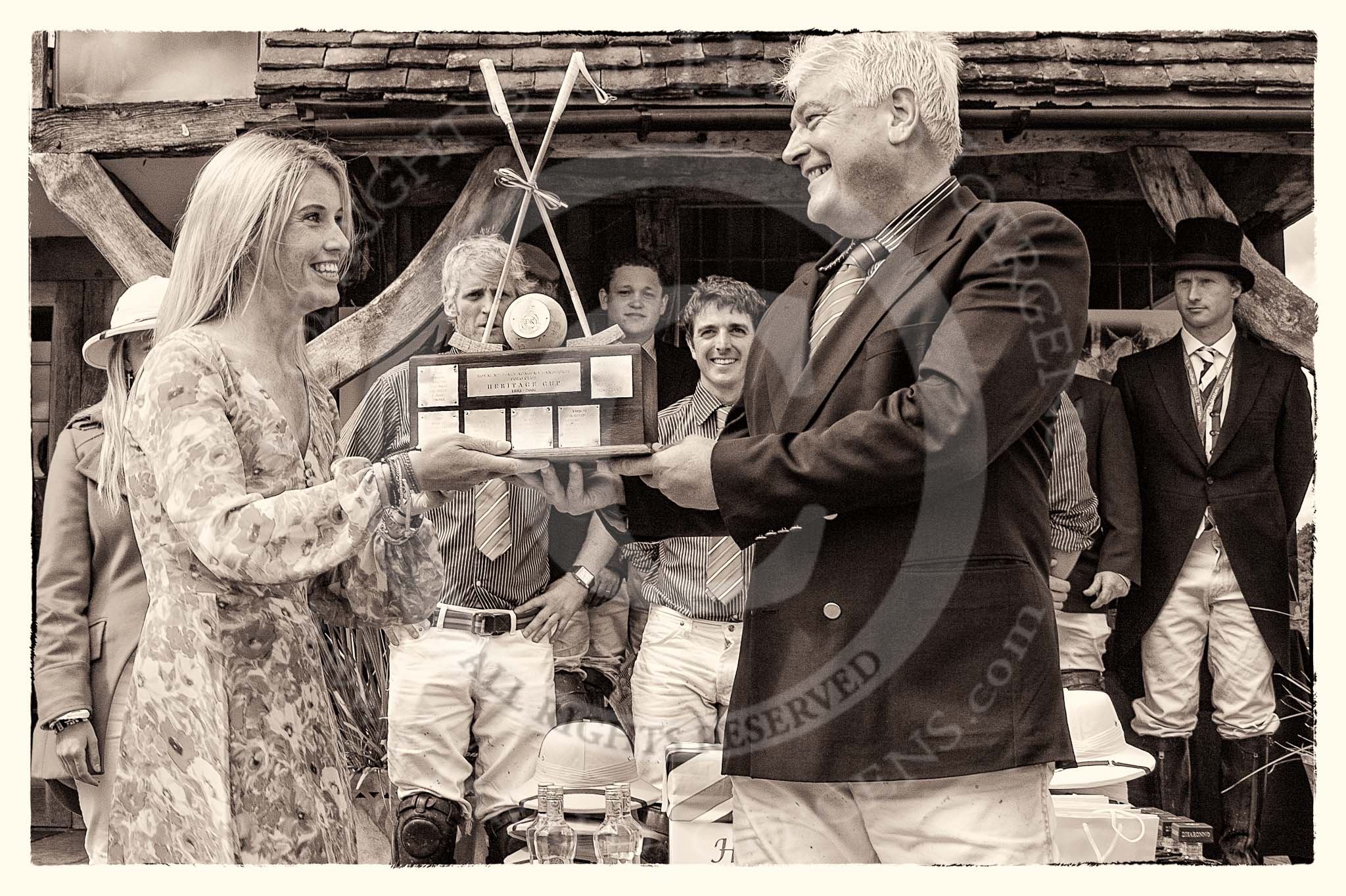 7th Heritage Polo Cup finals: Sponsor Claire Cotton of "Cotton & Gems" presenting the Trophy 
HERITAGE POLO CUP to  WINNER 2012 Silver Fox Polo Patron Parke Bradley..
Hurtwood Park Polo Club,
Ewhurst Green,
Surrey,
United Kingdom,
on 05 August 2012 at 14:40, image #87