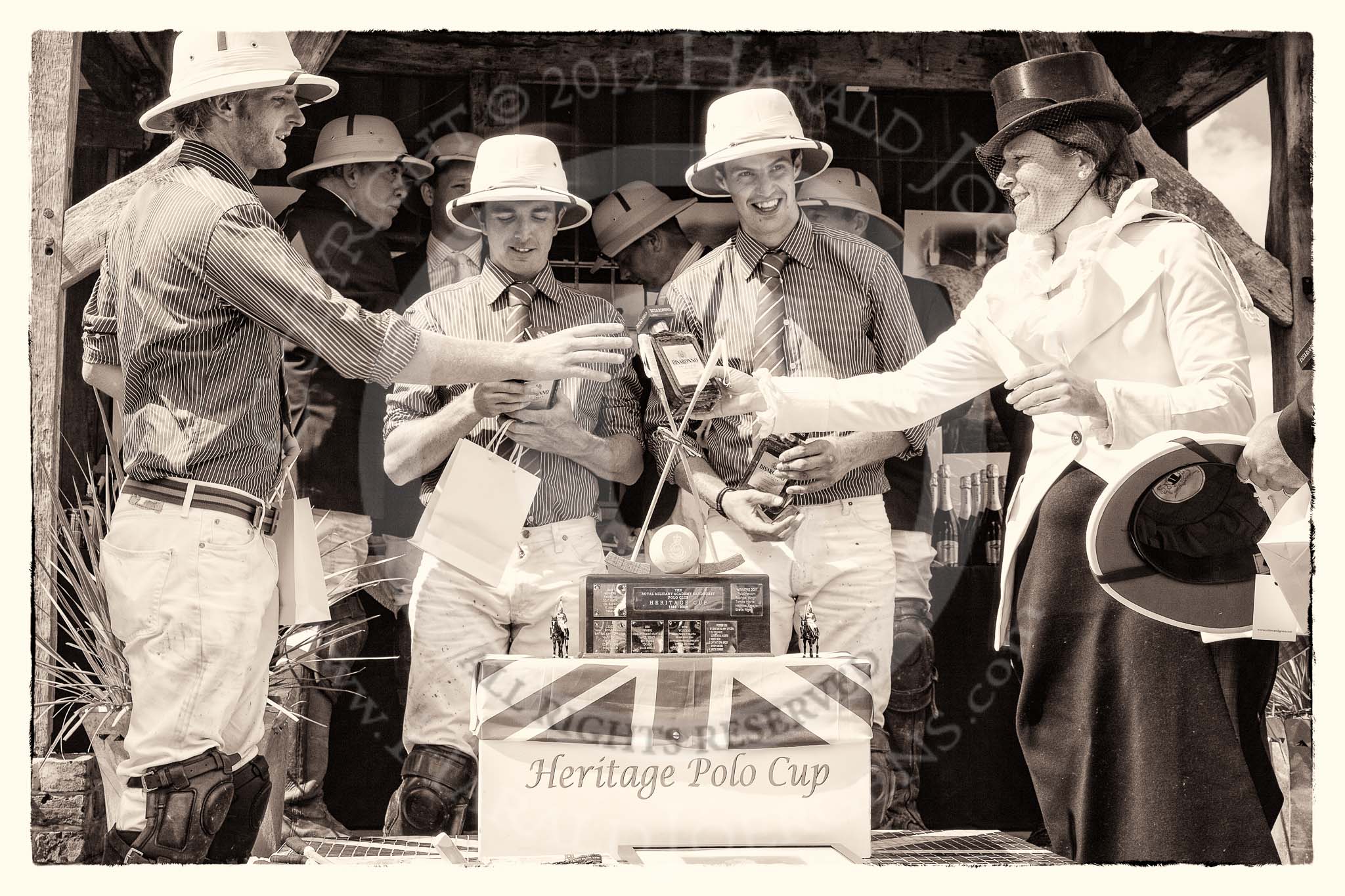 7th Heritage Polo Cup finals: Founder of HERITAGE POLO Barbara P Zingg presenting Silver Fox USA Polo Team with a bottle of 'Amaretto di Saronno'..
Hurtwood Park Polo Club,
Ewhurst Green,
Surrey,
United Kingdom,
on 05 August 2012 at 14:44, image #100