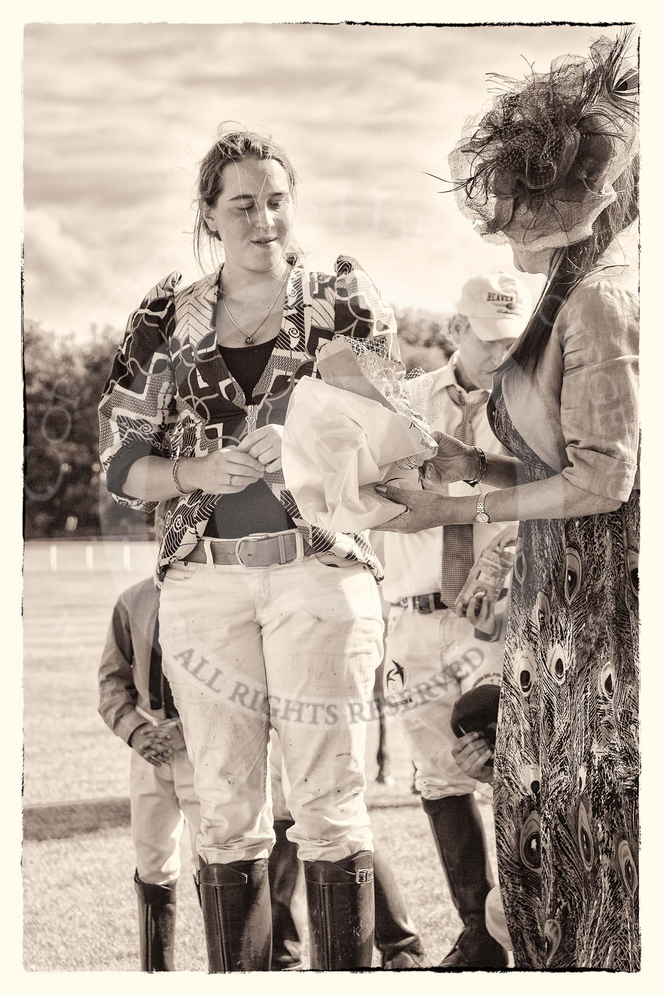 7th Heritage Polo Cup finals: Sophie Kyriazi from Kenia receiving the Prize of Jennifer Cattlin Millinery Creations 2012..
Hurtwood Park Polo Club,
Ewhurst Green,
Surrey,
United Kingdom,
on 05 August 2012 at 16:57, image #240