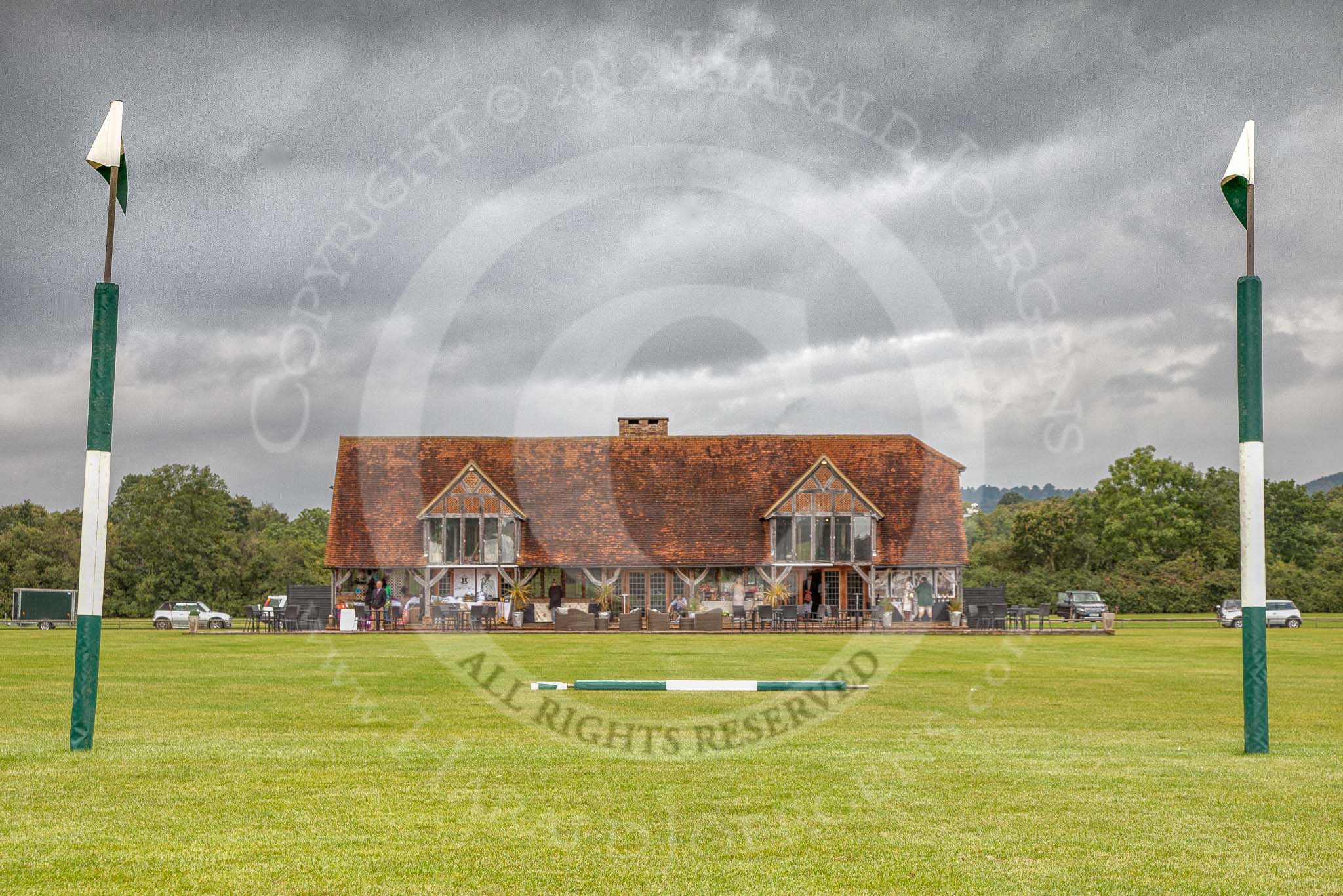 7th Heritage Polo Cup finals: Clubhouse of Hurtwood Park Polo Club, near Ewhurst in Surrey, seen through the goal posts..
Hurtwood Park Polo Club,
Ewhurst Green,
Surrey,
United Kingdom,
on 05 August 2012 at 11:44, image #2