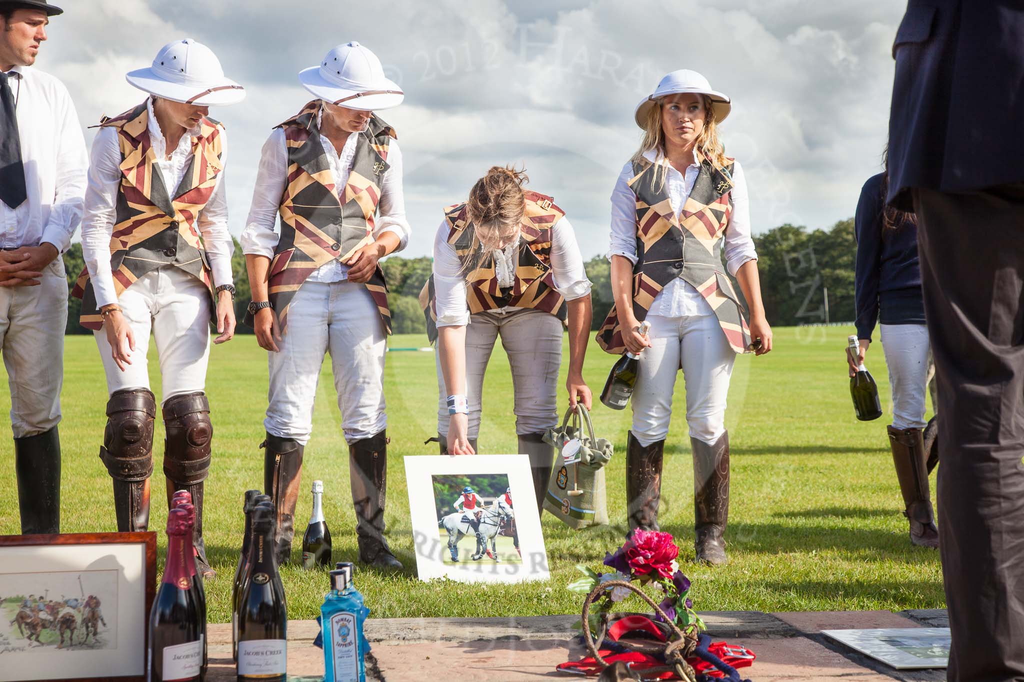 7th Heritage Polo Cup finals: Ladies of the British Empire Liberty Freedom 
Leigh Fisher, Sarah Wisman, Rosie Ross, Charlie Howel in Ascot Top Hat Pith Helmets..
Hurtwood Park Polo Club,
Ewhurst Green,
Surrey,
United Kingdom,
on 05 August 2012 at 17:00, image #252