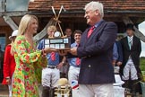 7th Heritage Polo Cup finals: Sponsor Claire Cotton of "Cotton & Gems" presenting the Trophy 
HERITAGE POLO CUP to  WINNER 2012 Silver Fox Polo Patron Parke Bradley..
Hurtwood Park Polo Club,
Ewhurst Green,
Surrey,
United Kingdom,
on 05 August 2012 at 14:40, image #87