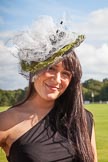 7th Heritage Polo Cup finals: Annabel Cattlin wearing one of her mother's Millinery Creations 2012..
Hurtwood Park Polo Club,
Ewhurst Green,
Surrey,
United Kingdom,
on 05 August 2012 at 16:48, image #229