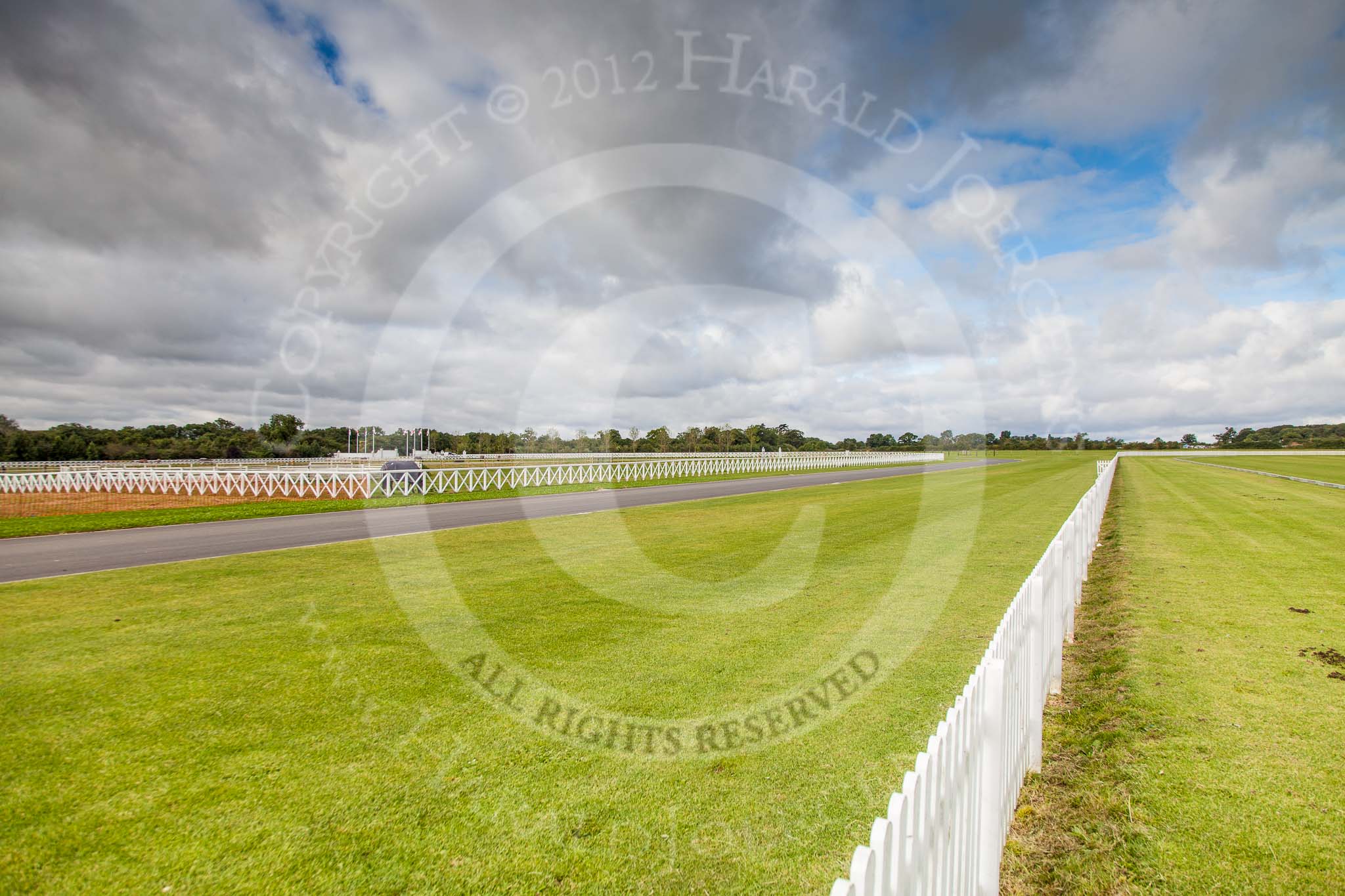 DBPC Polo in the Park 2012: Seen from the silver pitch, where the first matches of the day were played - the main road into the Dallas Burston Polo Grounds, with the main entrance on the left, marked with the six flags..
Dallas Burston Polo Club,
Stoneythorpe Estate,
Southam,
Warwickshire,
United Kingdom,
on 16 September 2012 at 09:59, image #21