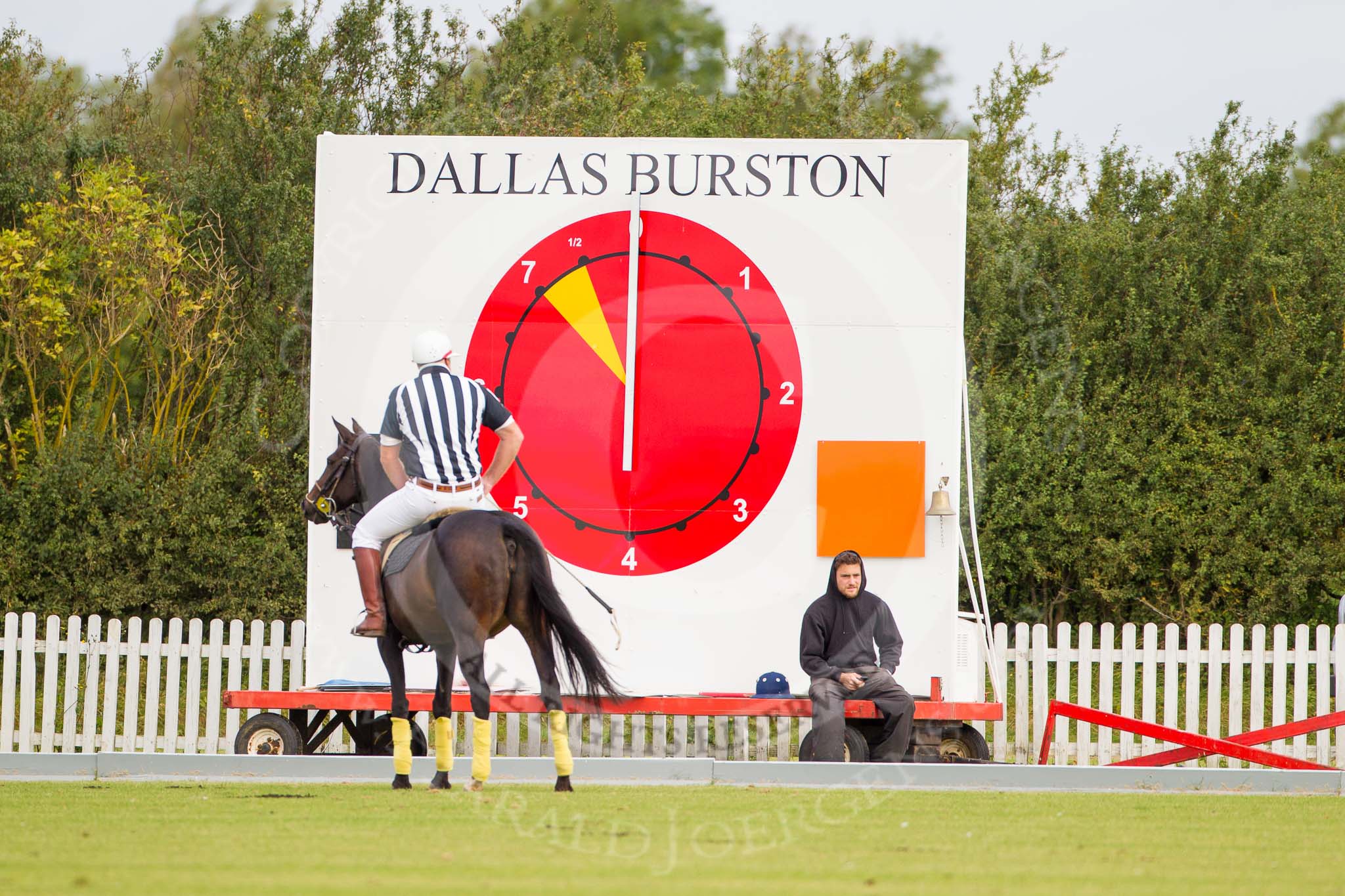 Photo 1209161002491D44634HaraldJoergens DBPC Polo in the Park 2012: The time- and results board at the Silver Pitch, umpire Ian 'Ginger' Hunt checking everything is readty for the first match..
Dallas Burston Polo Club,
Stoneythorpe Estate,
Southam,
Warwickshire,
United Kingdom,
on 16 September 2012 at 10:02, image #25