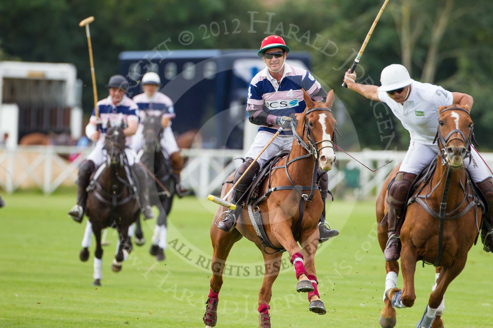 DBPC Polo in the Park 2012: JCS Polo team #4, Sebastian Funes, and Rated People #2, Tariq Dag Khan. In the background JCS #1, Andy Coulbeck, and #2, Louise Coulbeck..
Dallas Burston Polo Club,
Stoneythorpe Estate,
Southam,
Warwickshire,
United Kingdom,
on 16 September 2012 at 11:14, image #79