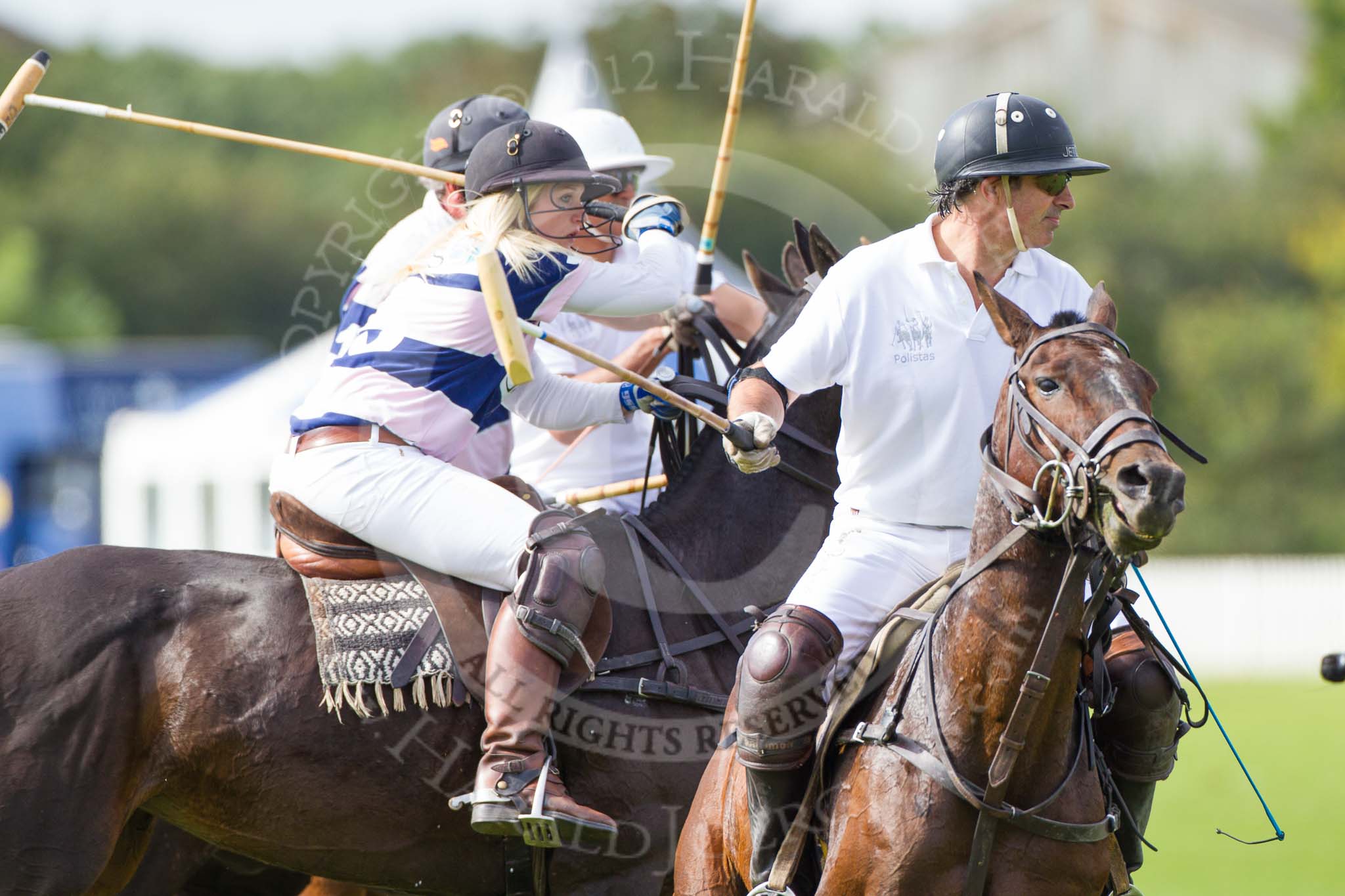 Photo 1209161118031D45371HaraldJoergens DBPC Polo in the Park 2012: Rated People Polo Team #2, Tariq Dag Khan . Behind JCS #3, Emma Nicolson, #1, Andy Coulbeck, and Rated 4#, Johnny Moreland-Lynn..
Dallas Burston Polo Club,
Stoneythorpe Estate,
Southam,
Warwickshire,
United Kingdom,
on 16 September 2012 at 11:18, image #85