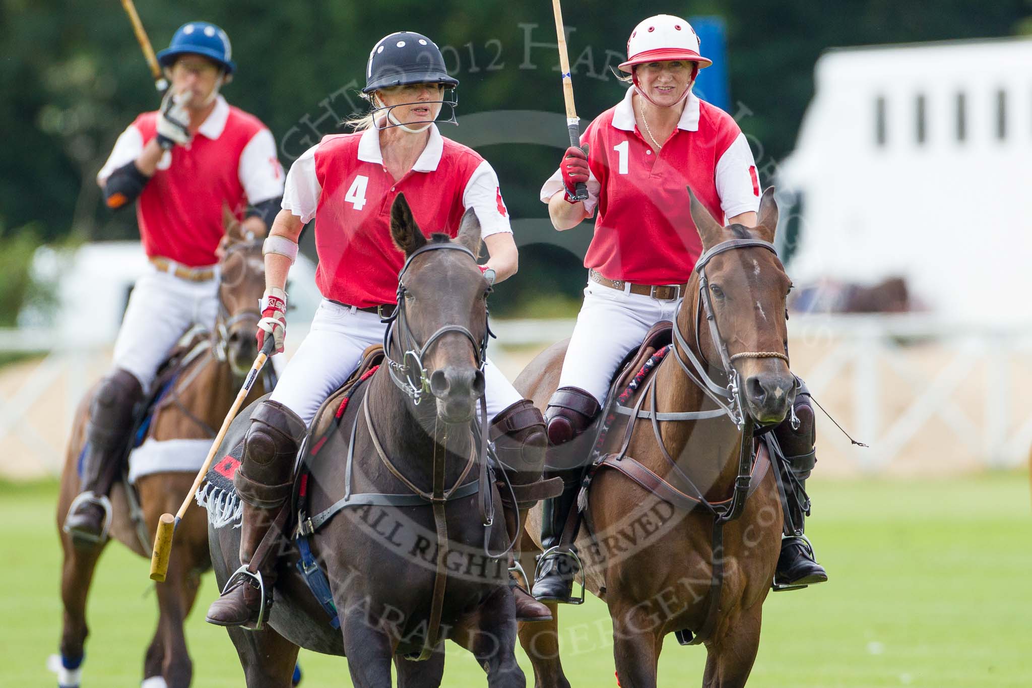 DBPC Polo in the Park 2012: Phoenix Polo Team #4, Susi Boyd, #1, Molly Davies, and #3, Tomy Iriarte..
Dallas Burston Polo Club,
Stoneythorpe Estate,
Southam,
Warwickshire,
United Kingdom,
on 16 September 2012 at 11:40, image #96