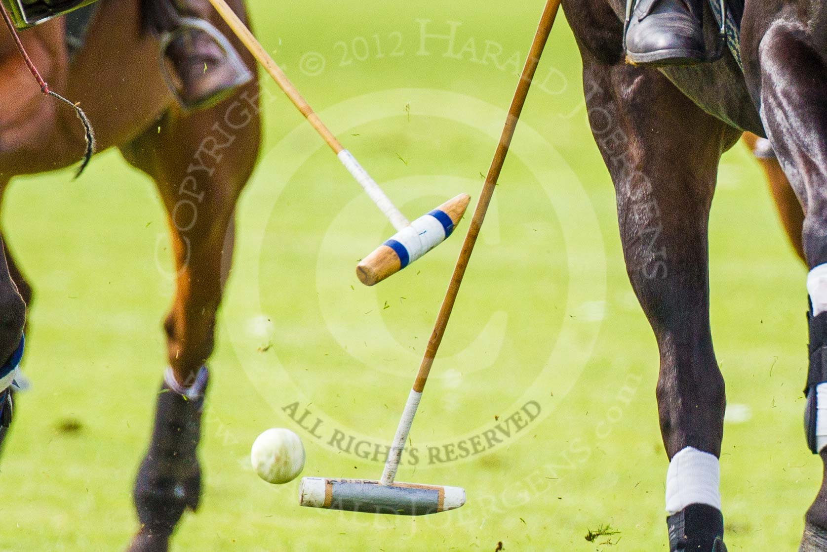 DBPC Polo in the Park 2012: Close-up Polo action with two mallets, a whip and a ball..
Dallas Burston Polo Club,
Stoneythorpe Estate,
Southam,
Warwickshire,
United Kingdom,
on 16 September 2012 at 11:57, image #113