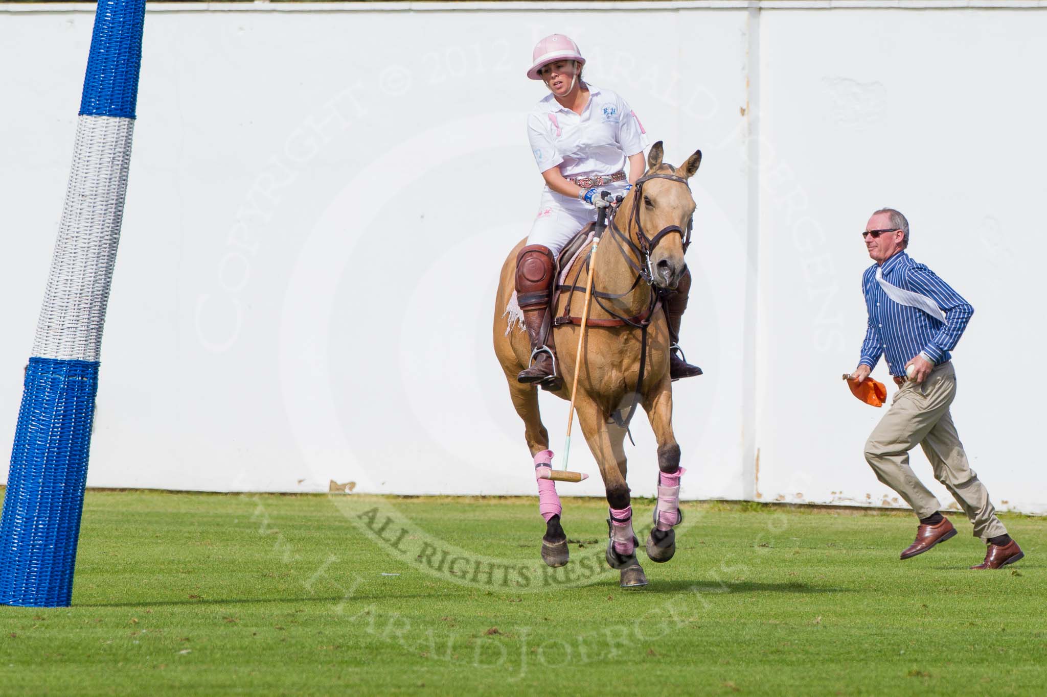 DBPC Polo in the Park 2012: Dawson Group Polo Team #1 Freya Dawson, having achieved another goal. Acting as goal judge is Colin Palmer..
Dallas Burston Polo Club,
Stoneythorpe Estate,
Southam,
Warwickshire,
United Kingdom,
on 16 September 2012 at 13:10, image #141