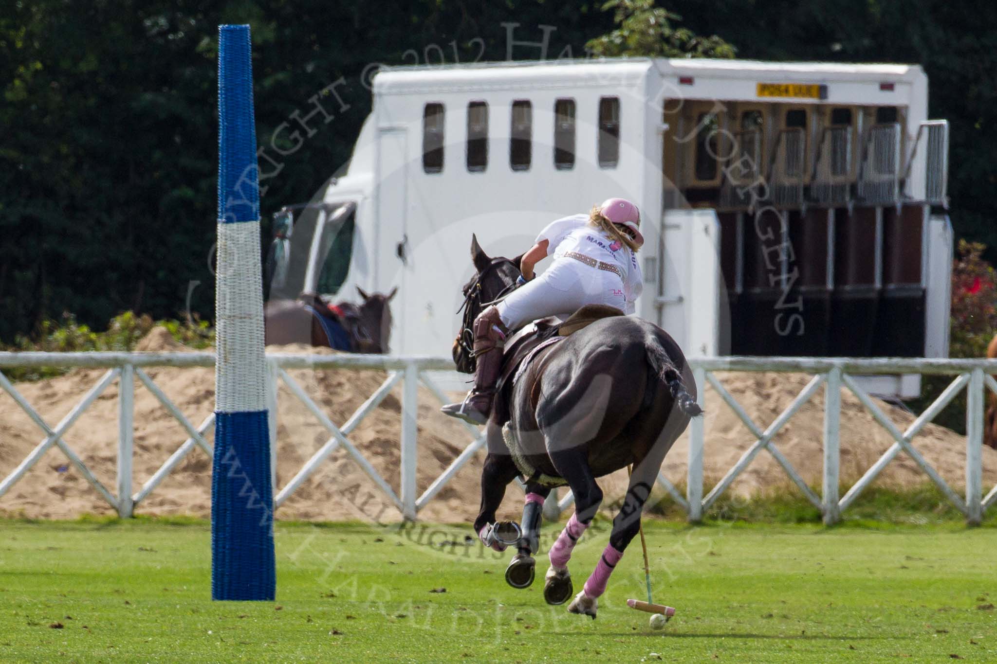 DBPC Polo in the Park 2012: Dawson Group Polo Team #1 Freya Dawson, having achieved yet another goal..
Dallas Burston Polo Club,
Stoneythorpe Estate,
Southam,
Warwickshire,
United Kingdom,
on 16 September 2012 at 13:19, image #145