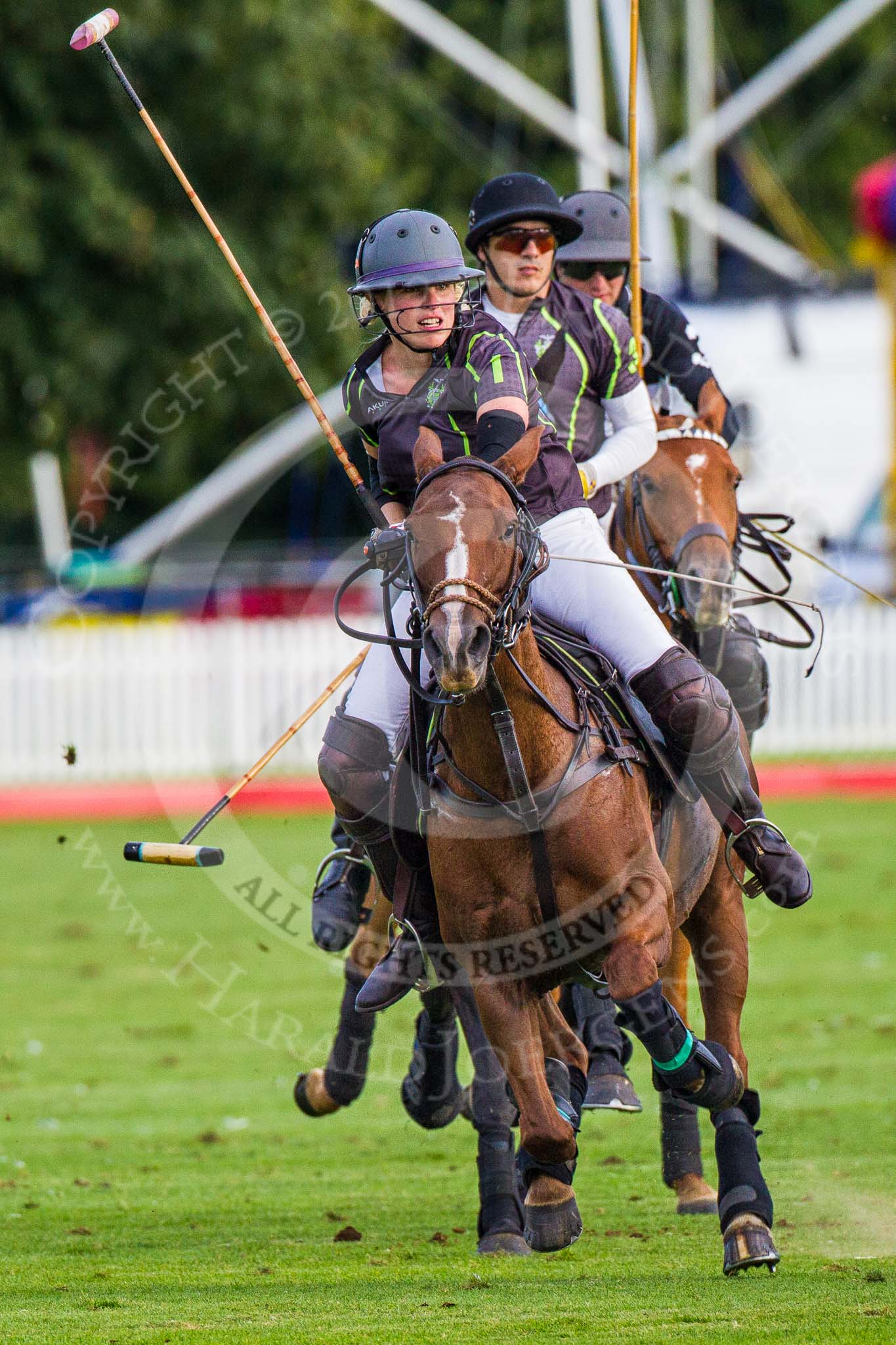 DBPC Polo in the Park 2012: Rigby & Rigby #1, Jenny Rigby, and #3, Tomy Iriarte, followed by La Golondrina #3, Pedro Harrison..
Dallas Burston Polo Club,
Stoneythorpe Estate,
Southam,
Warwickshire,
United Kingdom,
on 16 September 2012 at 17:43, image #292