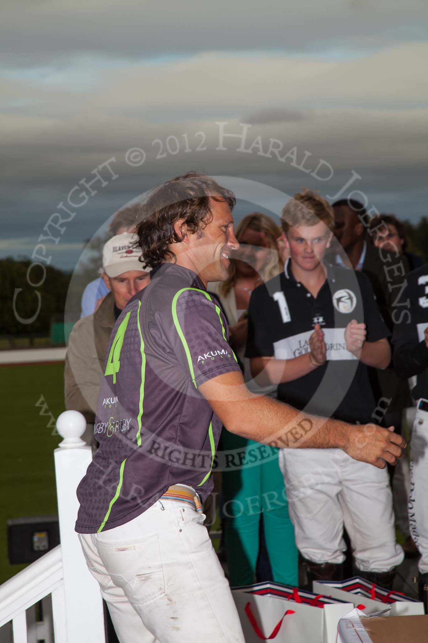 Photo 1209161812545D28653HaraldJoergens DBPC Polo in the Park 2012: Runner-up for the Dallas Burston Gold Cup Tournament was the team Rigby & Rigby. Here: Matias Amaya, behind her the winning La Golondrina team..
Dallas Burston Polo Club,
Stoneythorpe Estate,
Southam,
Warwickshire,
United Kingdom,
on 16 September 2012 at 18:12, image #315