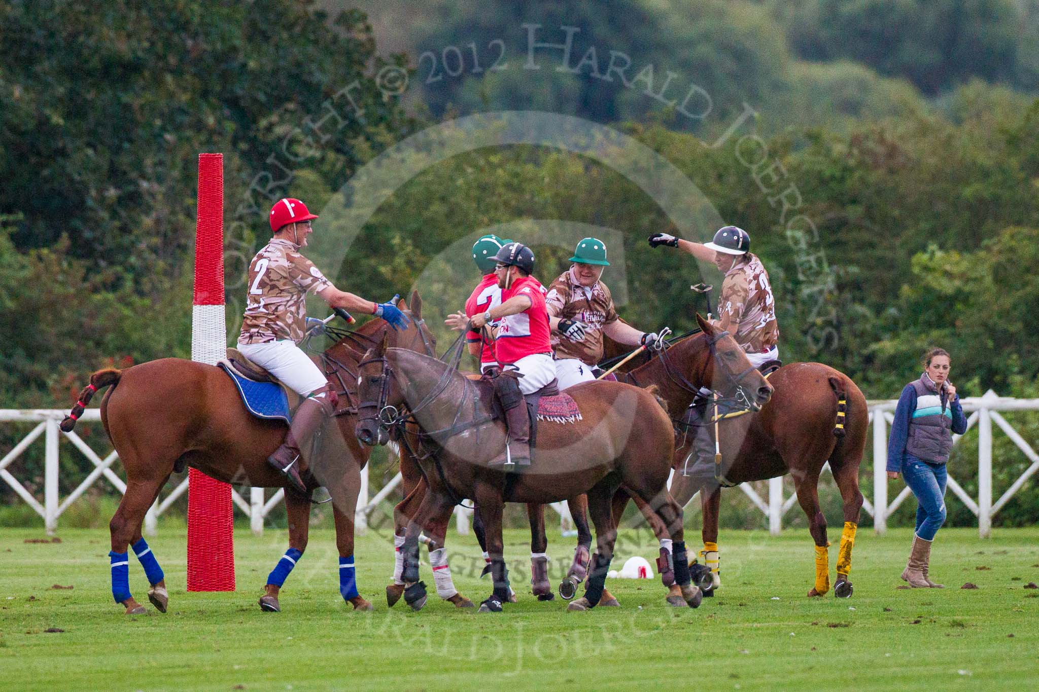 DBPC Polo in the Park 2012: Handshakes after the match - Royal Artillery v DBPC home team..
Dallas Burston Polo Club,
Stoneythorpe Estate,
Southam,
Warwickshire,
United Kingdom,
on 16 September 2012 at 19:02, image #347