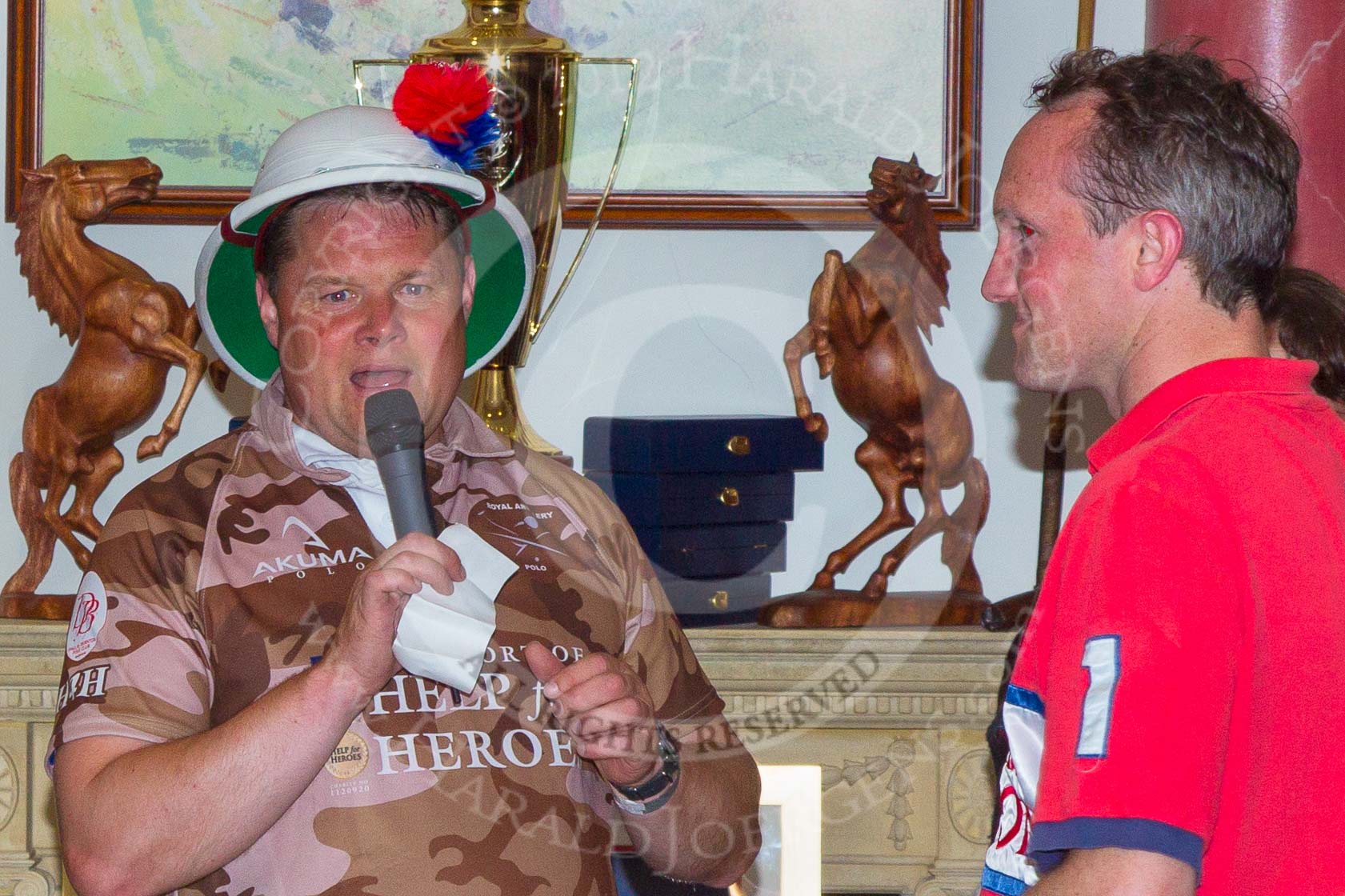 DBPC Polo in the Park 2012: Bombardier Richard Morris for the Royal Artillery polo team and Major Robert Skeggs for the DBPC team at the price giving in the clubhouse..
Dallas Burston Polo Club,
Stoneythorpe Estate,
Southam,
Warwickshire,
United Kingdom,
on 16 September 2012 at 19:17, image #349