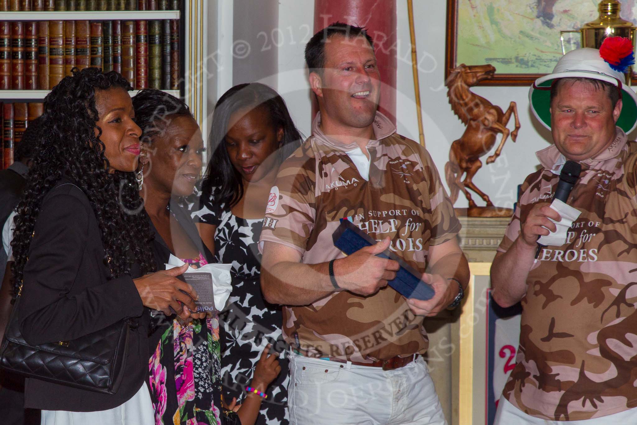 DBPC Polo in the Park 2012: Major Andy Wood and Bombardier Richard Morris  for the Royal Artillery polo team at the price giving in the clubhouse..
Dallas Burston Polo Club,
Stoneythorpe Estate,
Southam,
Warwickshire,
United Kingdom,
on 16 September 2012 at 19:19, image #351