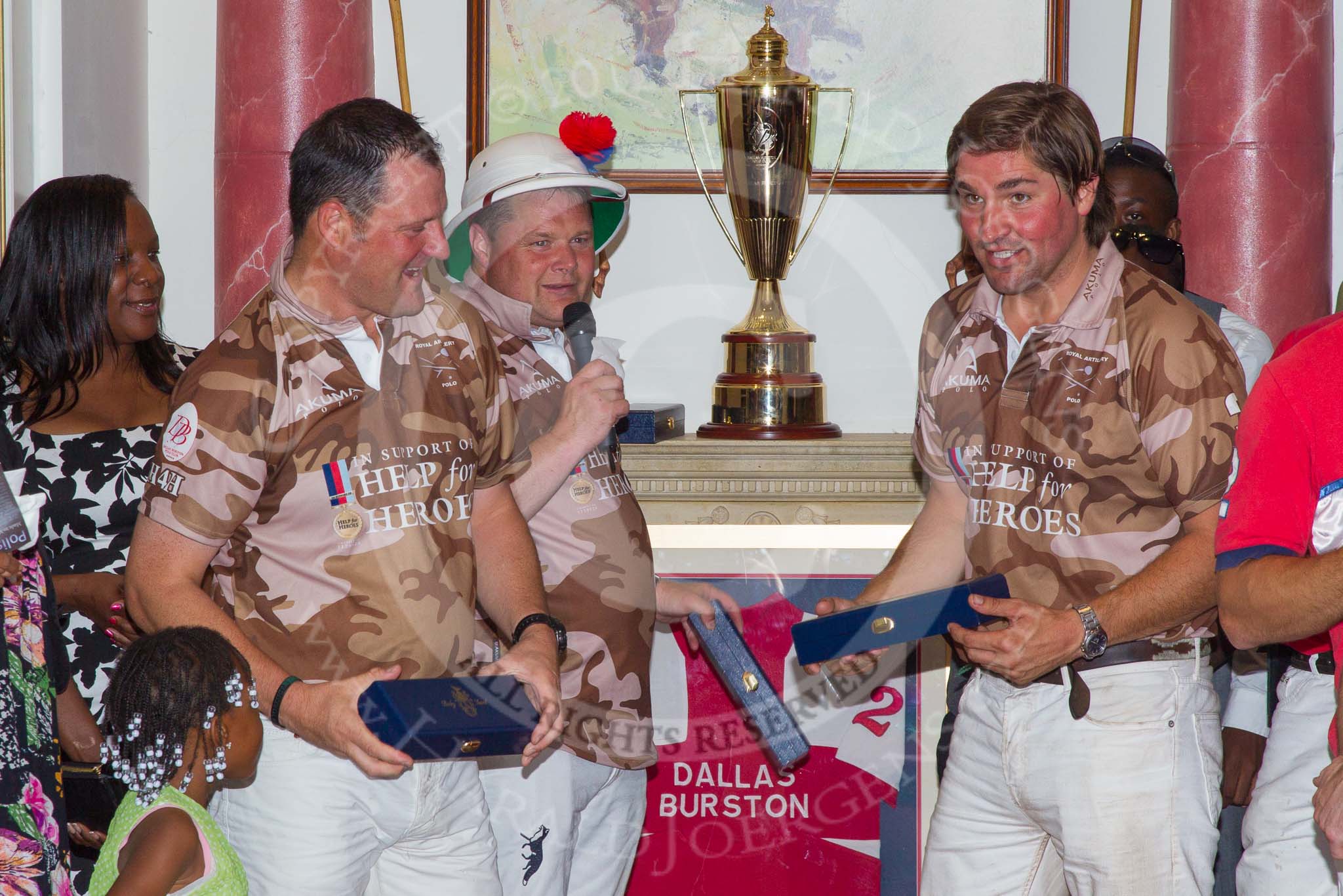 DBPC Polo in the Park 2012: Major Andy Wood, Bombardier Richard Morris, and Karl Ude-Martinez for the Royal Artillery polo team at the price giving in the clubhouse..
Dallas Burston Polo Club,
Stoneythorpe Estate,
Southam,
Warwickshire,
United Kingdom,
on 16 September 2012 at 19:19, image #352