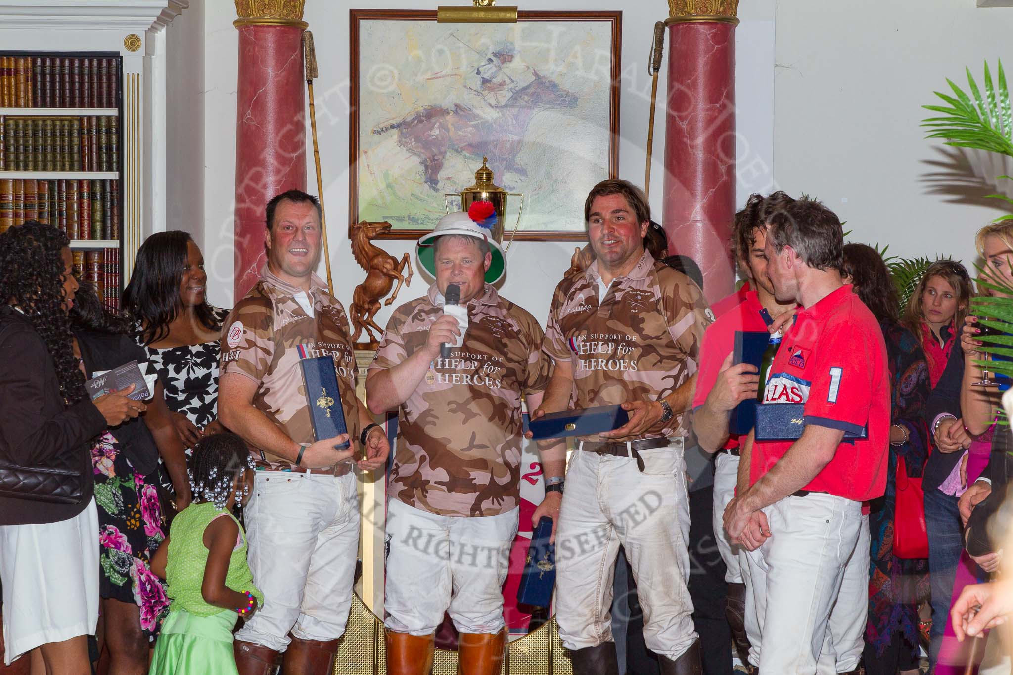 DBPC Polo in the Park 2012: Major Andy Wood, Bombardier Richard Morris and Karl Ude-Martinez for the Royal Artillery polo team, Captain William Mawby and Major Robert Skeggs for the DBPC team at the price giving in the clubhouse..
Dallas Burston Polo Club,
Stoneythorpe Estate,
Southam,
Warwickshire,
United Kingdom,
on 16 September 2012 at 19:19, image #353