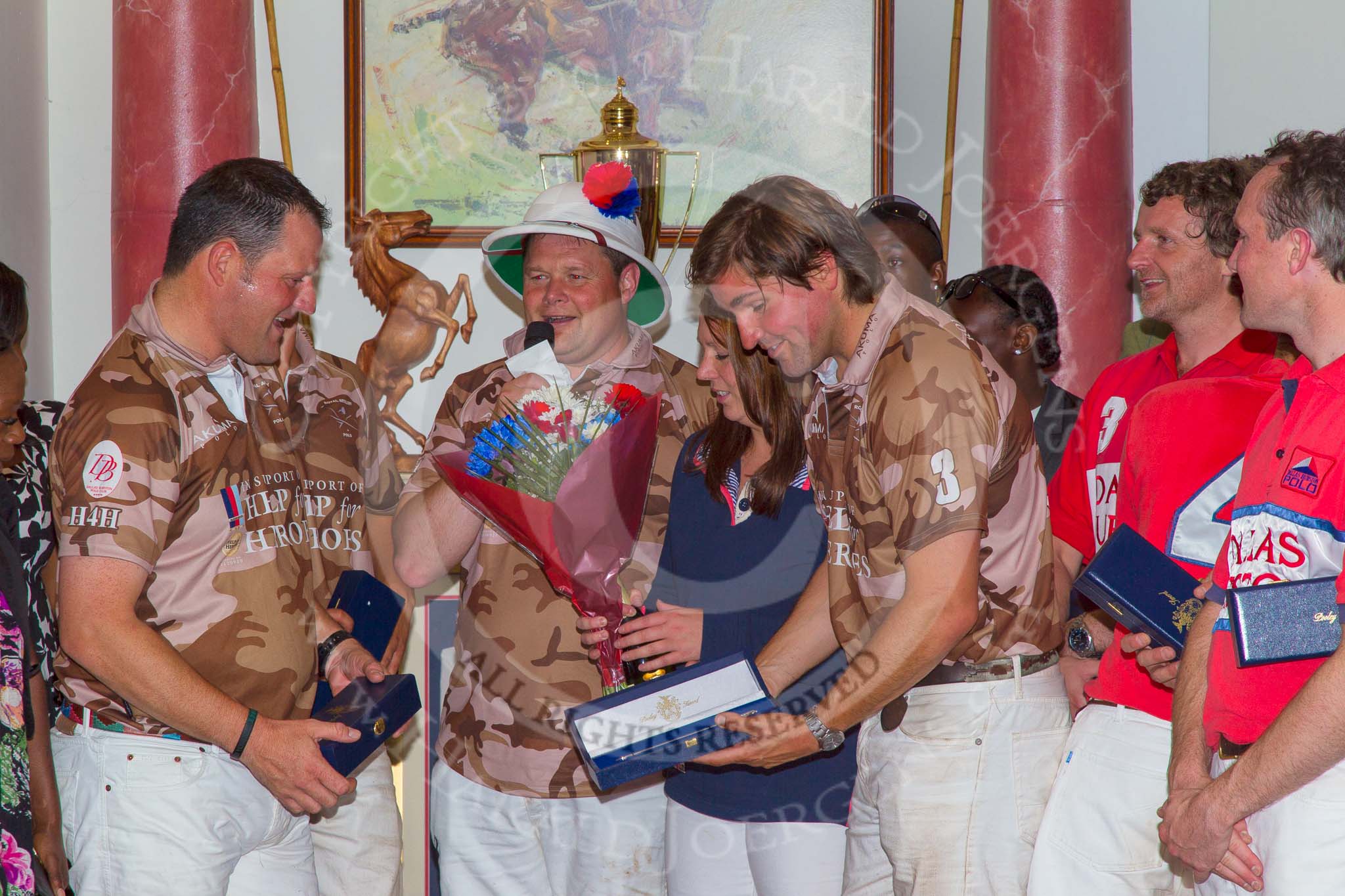 Photo 1209161919541D47808HaraldJoergensE1493 DBPC Polo in the Park 2012: Major Andy Wood, a slightly hidden Alex Vent, Bombardier Richard Morris, and Karl Ude-Martinez for the Royal Artillery polo team and Captain William Mawby and Major Robert Skeggs for the DBPC team at the price giving in the clubhouse..
Dallas Burston Polo Club,
Stoneythorpe Estate,
Southam,
Warwickshire,
United Kingdom,
on 16 September 2012 at 19:19, image #355