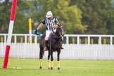 DBPC Polo in the Park 2012: The umpire and club polo manager Ian 'Ginger' Hunt, dropping a goal flags at one goal in preparation for the first match..
Dallas Burston Polo Club,
Stoneythorpe Estate,
Southam,
Warwickshire,
United Kingdom,
on 16 September 2012 at 10:02, image #24
