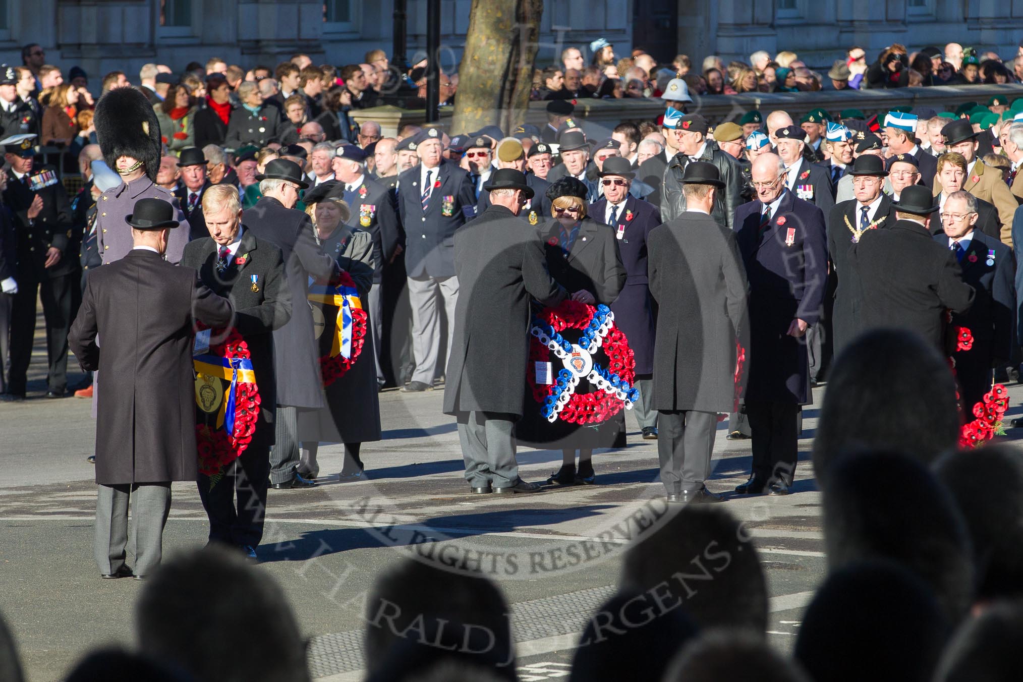 Remembrance Sunday 2012 Cenotaph March Past: Vice-Admiral Peter Wilkinson, the President of the Royal British Legion, will lead the march past.
 Behind him wreaths are handed over to the first group that will follow him to the Cenotaph..
Whitehall, Cenotaph,
London SW1,

United Kingdom,
on 11 November 2012 at 11:26, image #4