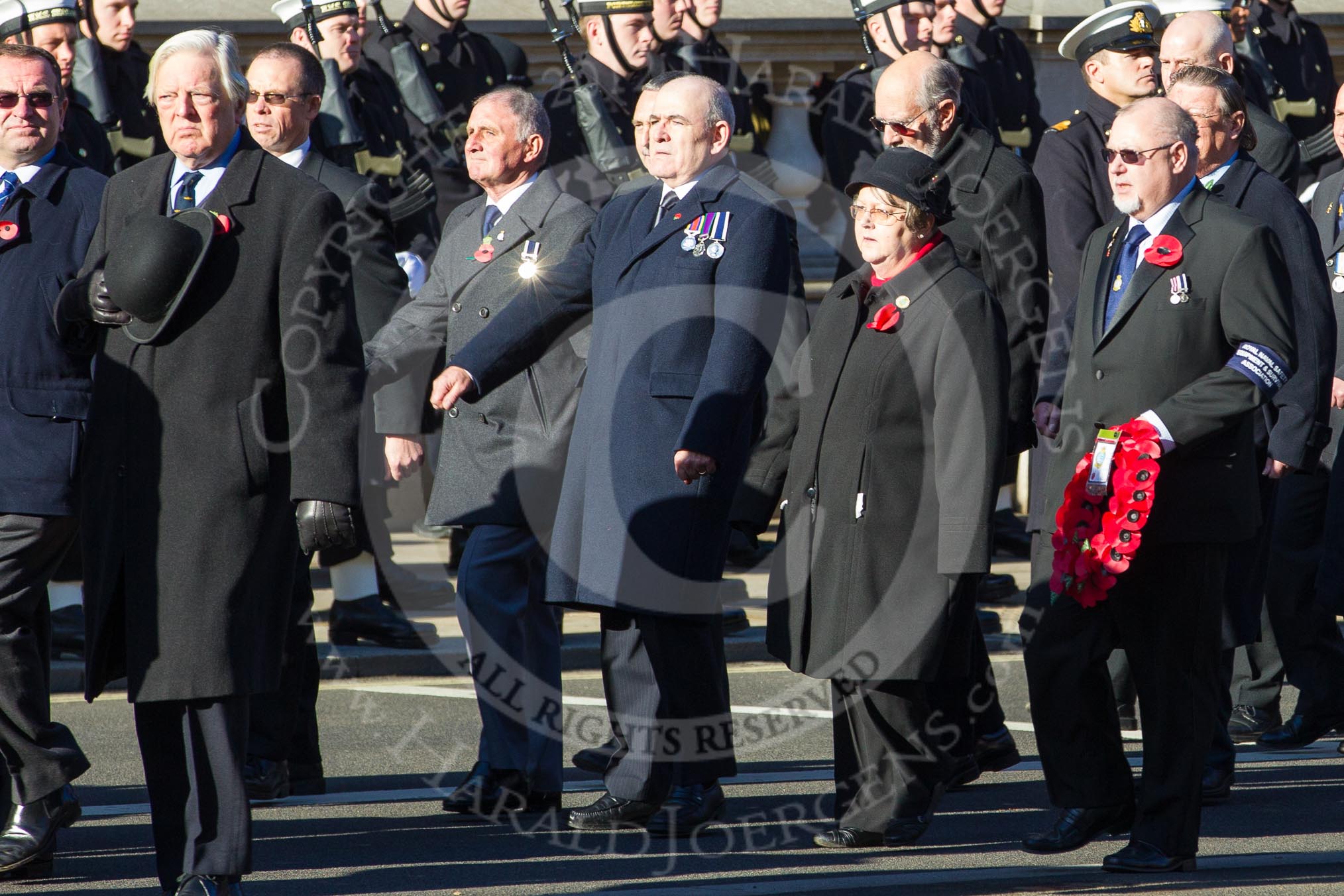 Remembrance Sunday 2012 Cenotaph March Past: Group E14 - Fleet Air Arm Safety Equipment & Survival Association, in charge of service and maintenance of aircrew emergency equipment including Life-rafts, Personal Survival Packs, Parachutes and Aircrew clothing, as well as aircraft egress and land survival training. Wreath carrier and group leader is David Philpot,  Ex Chief Petty Officer (Airman) Survival Equipment..
Whitehall, Cenotaph,
London SW1,

United Kingdom,
on 11 November 2012 at 11:40, image #113