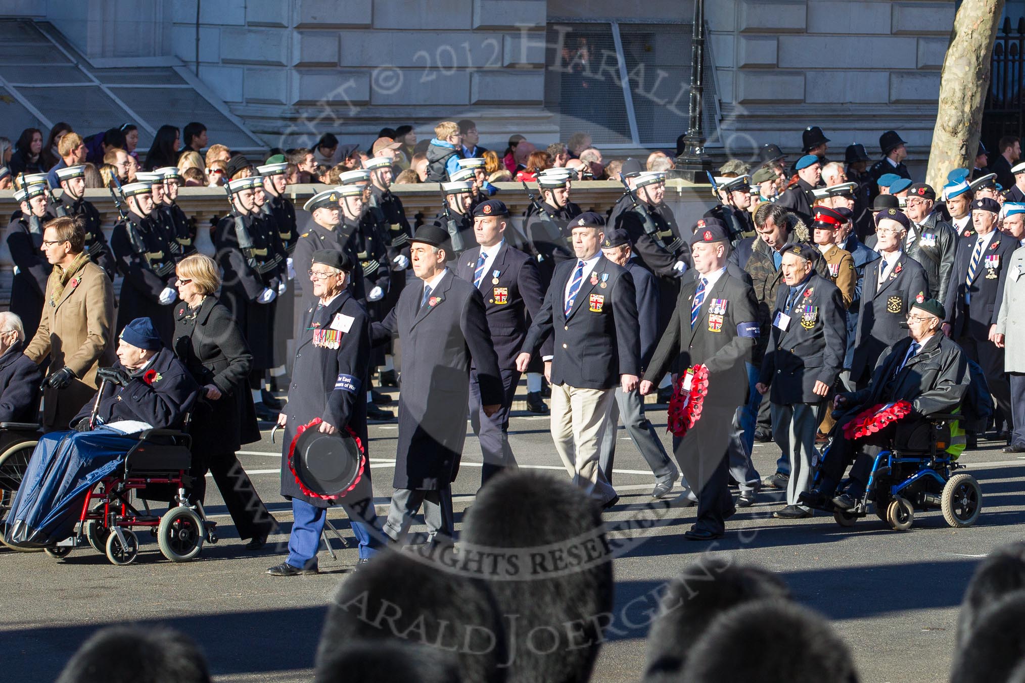 Remembrance Sunday 2012 Cenotaph March Past: Group F18 - Far East Prisoners of War and F19 - British Veterans Group..
Whitehall, Cenotaph,
London SW1,

United Kingdom,
on 11 November 2012 at 11:48, image #547