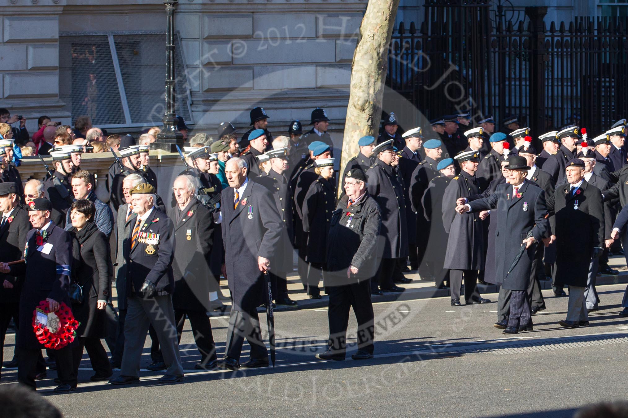 Remembrance Sunday 2012 Cenotaph March Past: Group A4 - Royal Sussex Regimental Association, A5 - Royal Hampshire Regiment Comrades Association, and A6 - Royal Regiment of Fusiliers..
Whitehall, Cenotaph,
London SW1,

United Kingdom,
on 11 November 2012 at 11:48, image #574