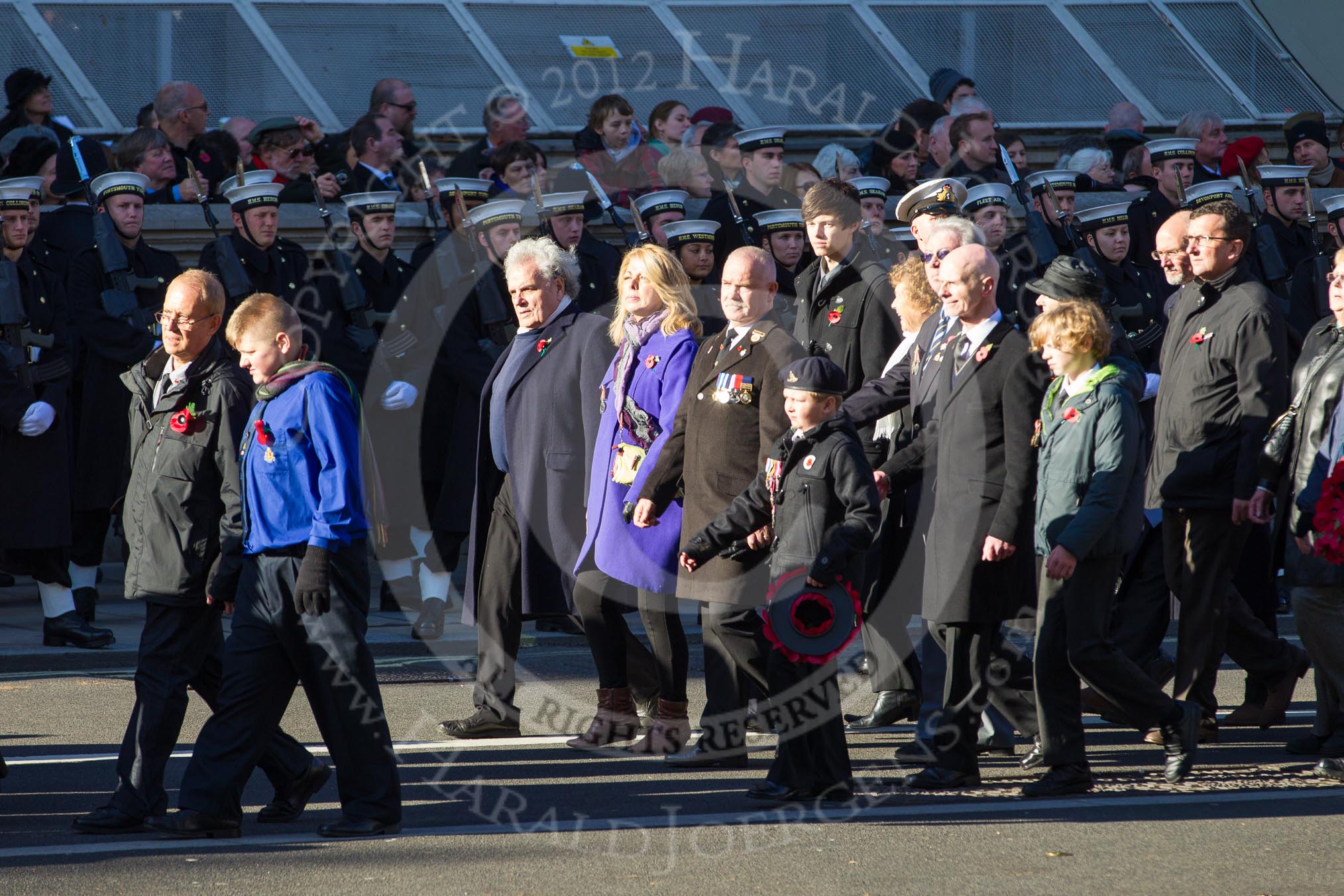 Remembrance Sunday 2012 Cenotaph March Past: Group M23 - Civilians Representing Families..
Whitehall, Cenotaph,
London SW1,

United Kingdom,
on 11 November 2012 at 12:12, image #1584
