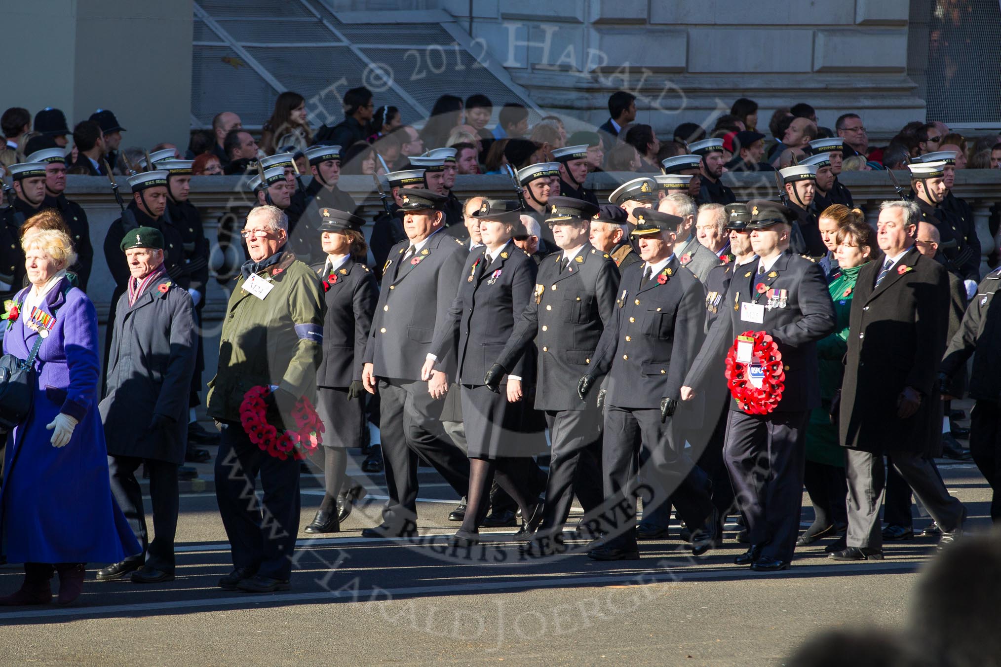 Remembrance Sunday 2012 Cenotaph March Past: Group M24 - Royal Mail Group Ltd and M25 - Royal Society for the Prevention of Cruelty to Animals..
Whitehall, Cenotaph,
London SW1,

United Kingdom,
on 11 November 2012 at 12:12, image #1591
