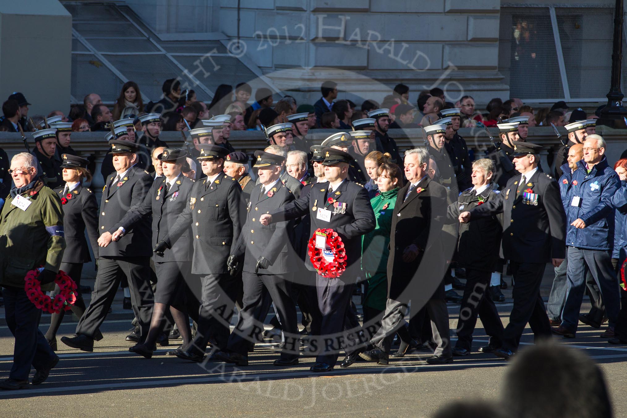 Remembrance Sunday 2012 Cenotaph March Past: Group M24 - Royal Mail Group Ltd and M25 - Royal Society for the Prevention of Cruelty to Animals..
Whitehall, Cenotaph,
London SW1,

United Kingdom,
on 11 November 2012 at 12:12, image #1592