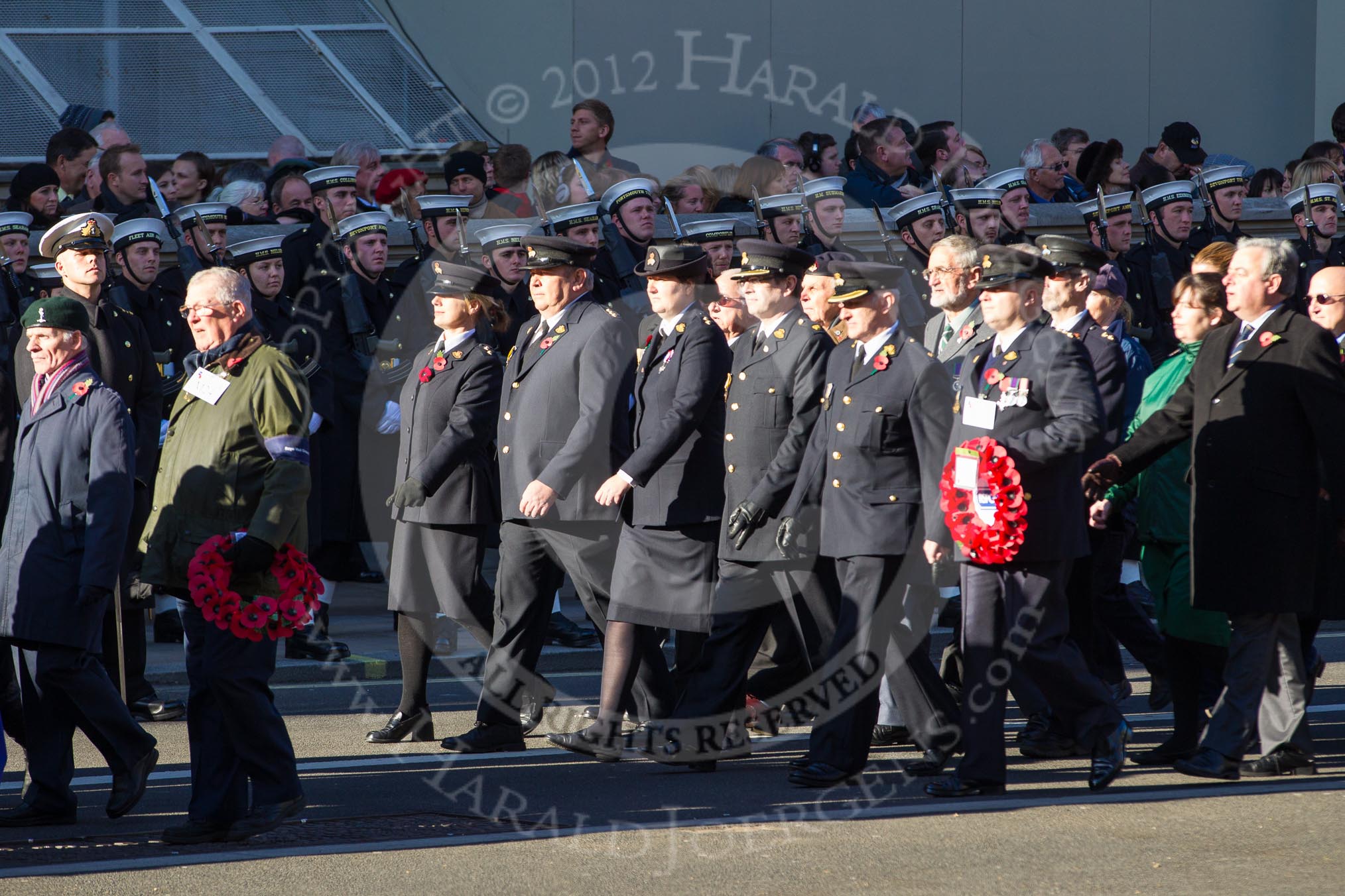 Remembrance Sunday 2012 Cenotaph March Past: Group M24 - Royal Mail Group Ltd and M25 - Royal Society for the Prevention of Cruelty to Animals..
Whitehall, Cenotaph,
London SW1,

United Kingdom,
on 11 November 2012 at 12:12, image #1594