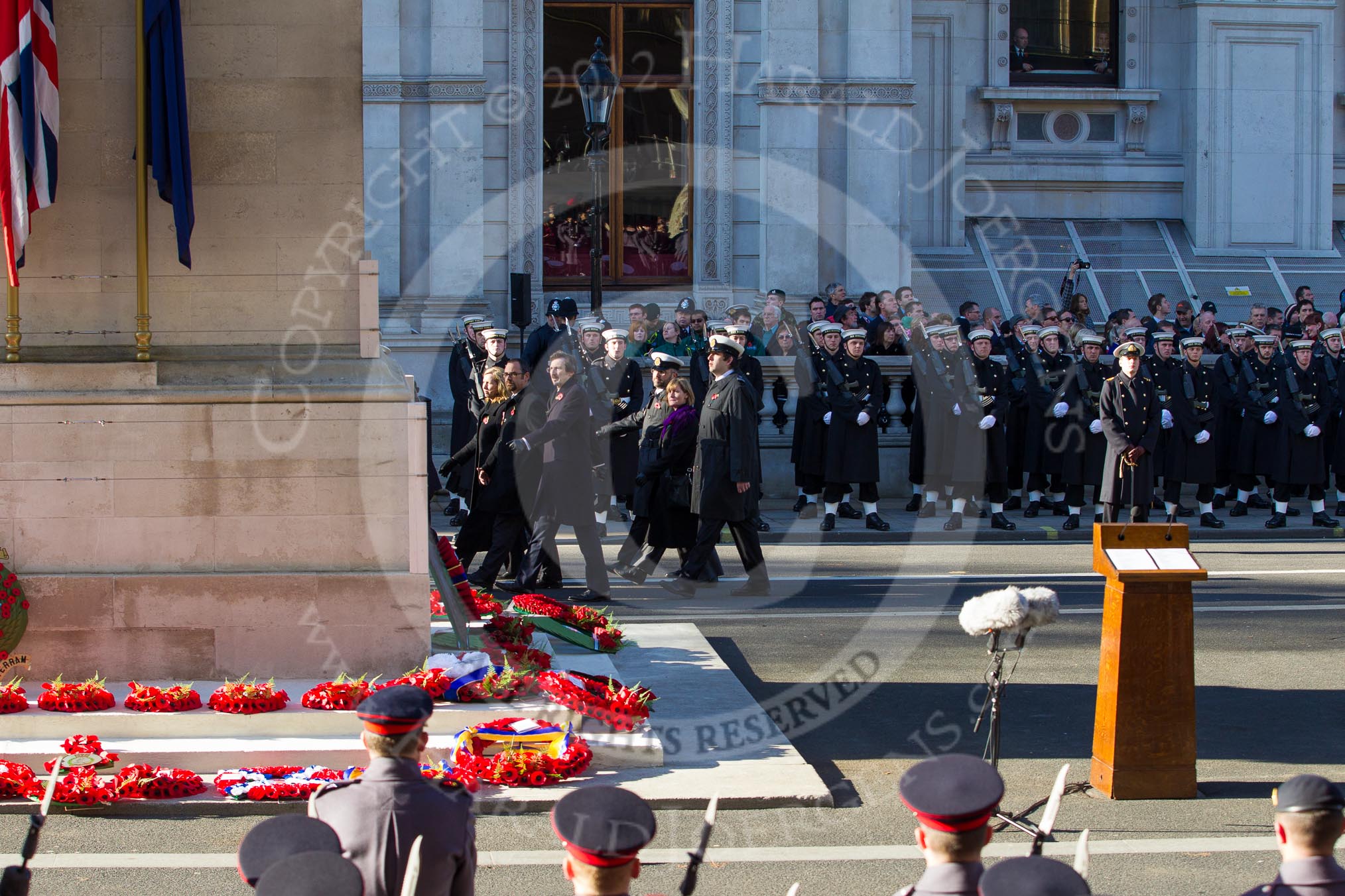 Photo 1211111216281D42470HaraldJoergens Remembrance Sunday 2012 Cenotaph March Past: The eastern side of the Cenotaph after the March Past, with the bright red of all the wreaths. Behind the lines of Royal Marines standing in front of the Foreign- and Commonweatlt Office building..
Whitehall, Cenotaph,
London SW1,
United Kingdom,
on 11 November 2012 at 12:16, image #1769