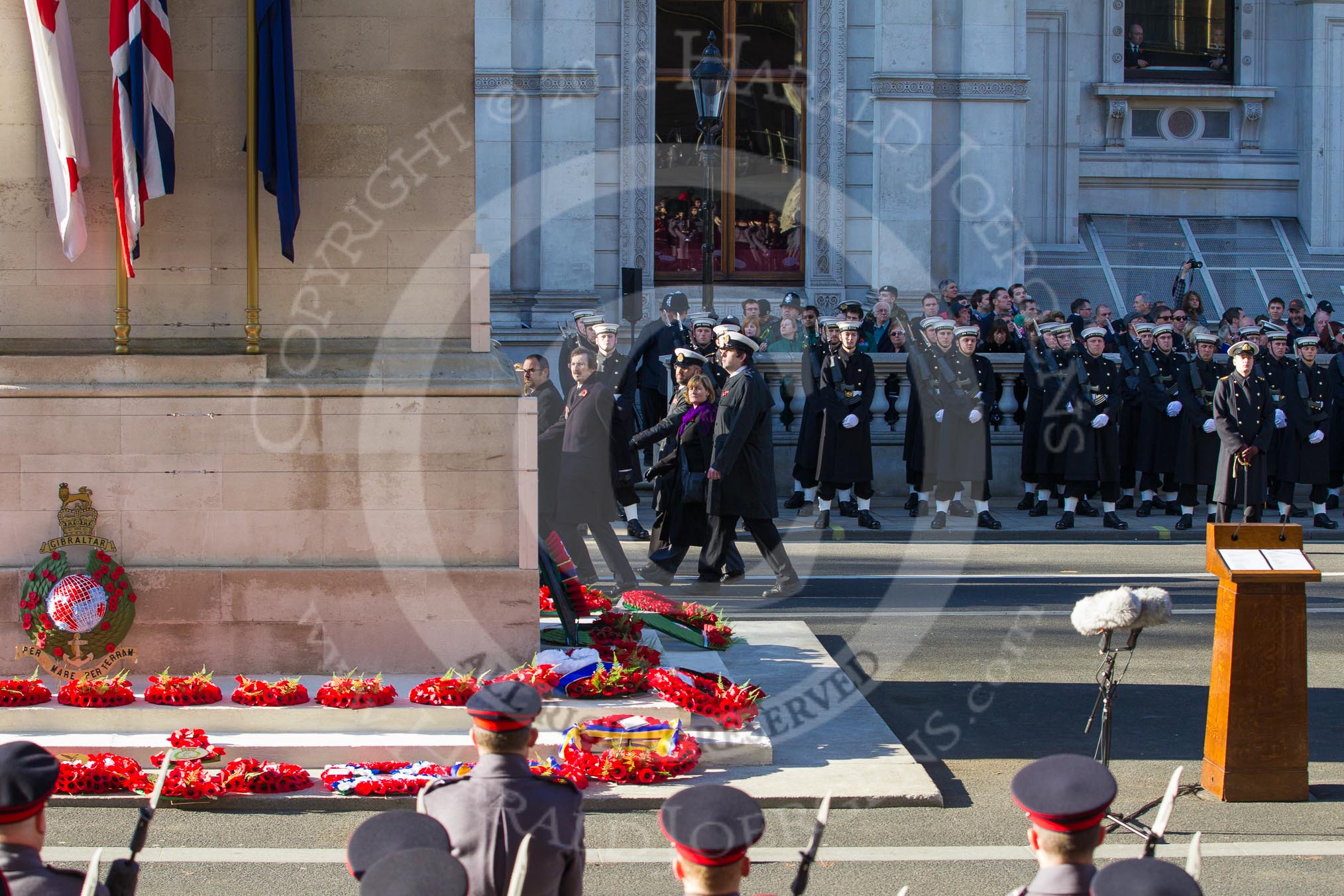 Remembrance Sunday 2012 Cenotaph March Past: The eastern side of the Cenotaph after the March Past, with the bright red of all the wreaths. Behind the lines of Royal Marines standing in front of the Foreign- and Commonweatlt Office building..
Whitehall, Cenotaph,
London SW1,

United Kingdom,
on 11 November 2012 at 12:16, image #1770