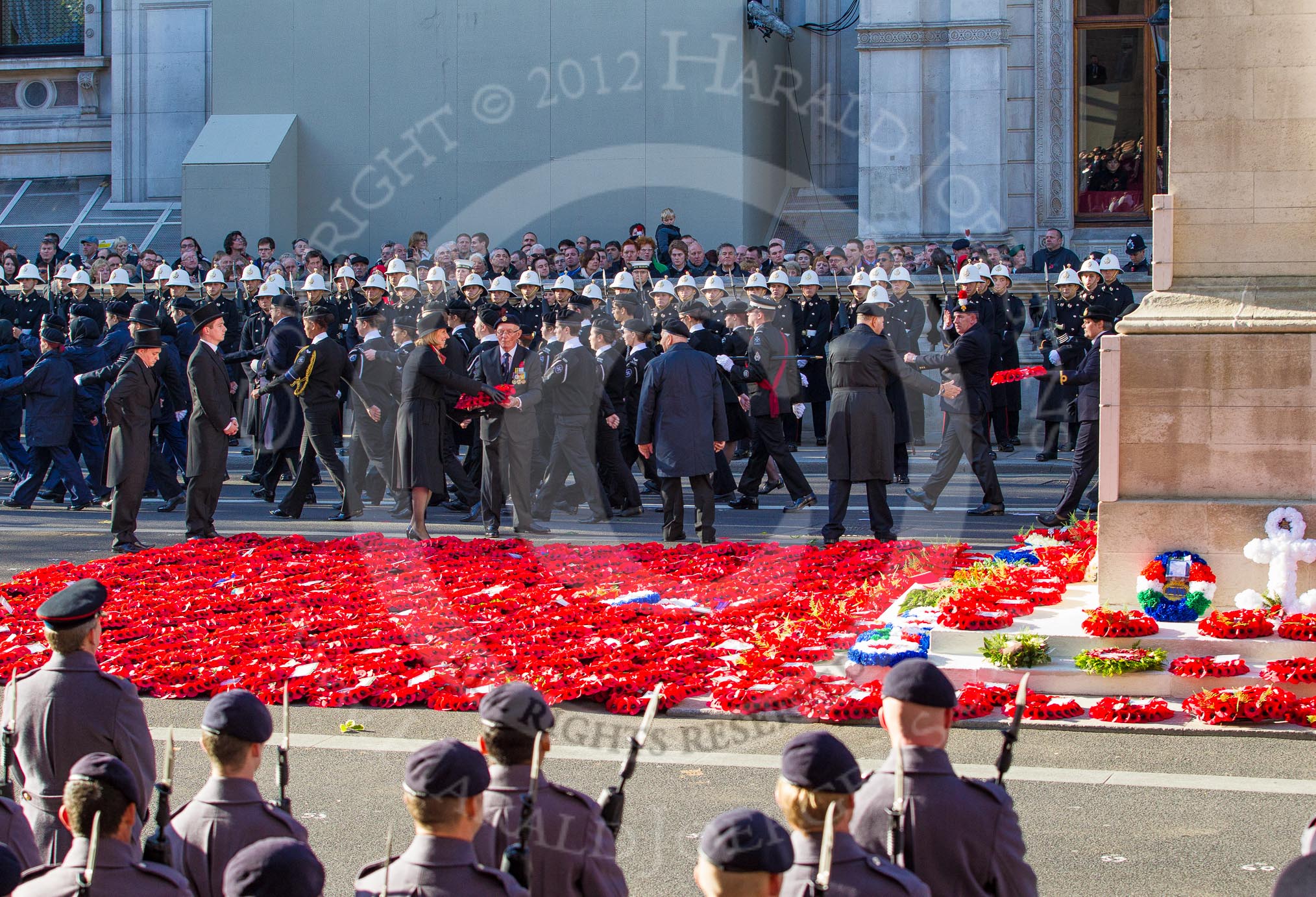 Photo 1211111216341D42477HaraldJoergensE1829 Remembrance Sunday 2012 Cenotaph March Past: Laying the last of the hundreds of wreaths from the March Past on the western side of the Cenotaph..
Whitehall, Cenotaph,
London SW1,
United Kingdom,
on 11 November 2012 at 12:16, image #1773