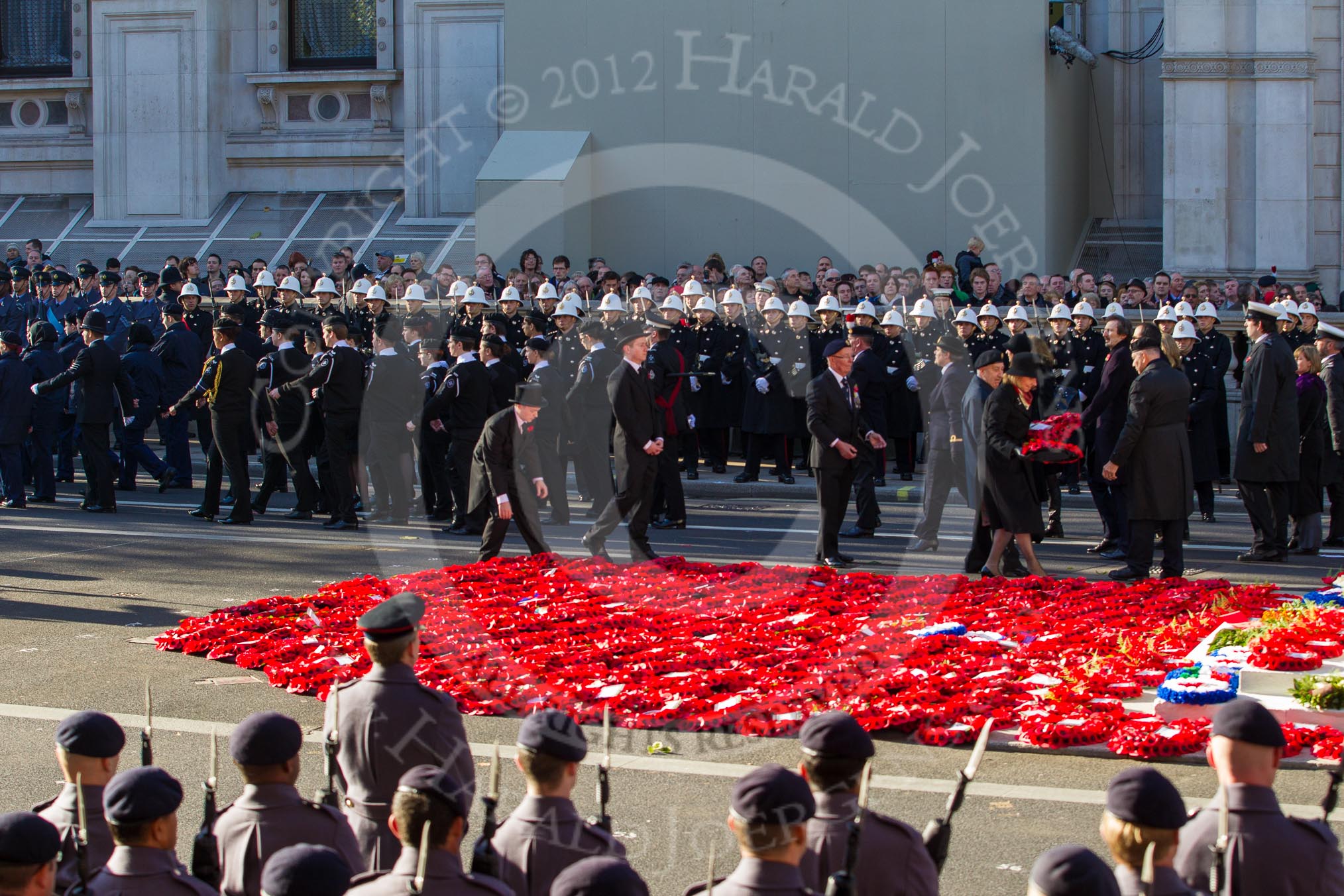 Remembrance Sunday 2012 Cenotaph March Past: Laying the last of the hundreds of wreaths from the March Past on the western side of the Cenotaph..
Whitehall, Cenotaph,
London SW1,

United Kingdom,
on 11 November 2012 at 12:16, image #1774