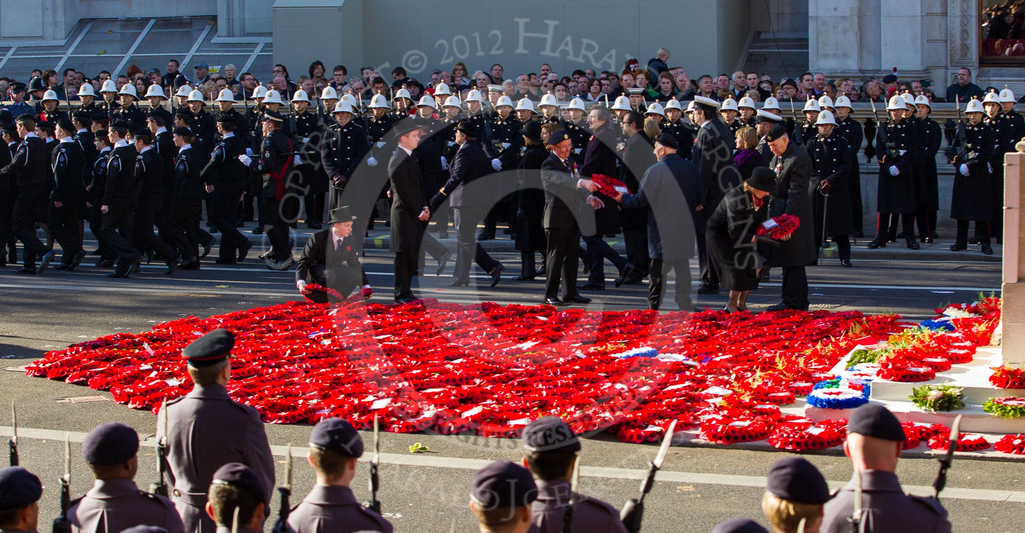 Remembrance Sunday 2012 Cenotaph March Past: Laying the last of the hundreds of wreaths from the March Past on the western side of the Cenotaph..
Whitehall, Cenotaph,
London SW1,

United Kingdom,
on 11 November 2012 at 12:16, image #1775