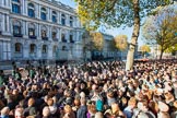 Remembrance Sunday 2012 Cenotaph March Past: Wide-angle view of the crowds, the Cenotaph,  and the Foreign- and Commonwealth building behind, after the ceremony and the March Past has finished, and the troops are marching off, whilst the crowd waits to step onto the street..
Whitehall, Cenotaph,
London SW1,

United Kingdom,
on 11 November 2012 at 12:24, image #1791