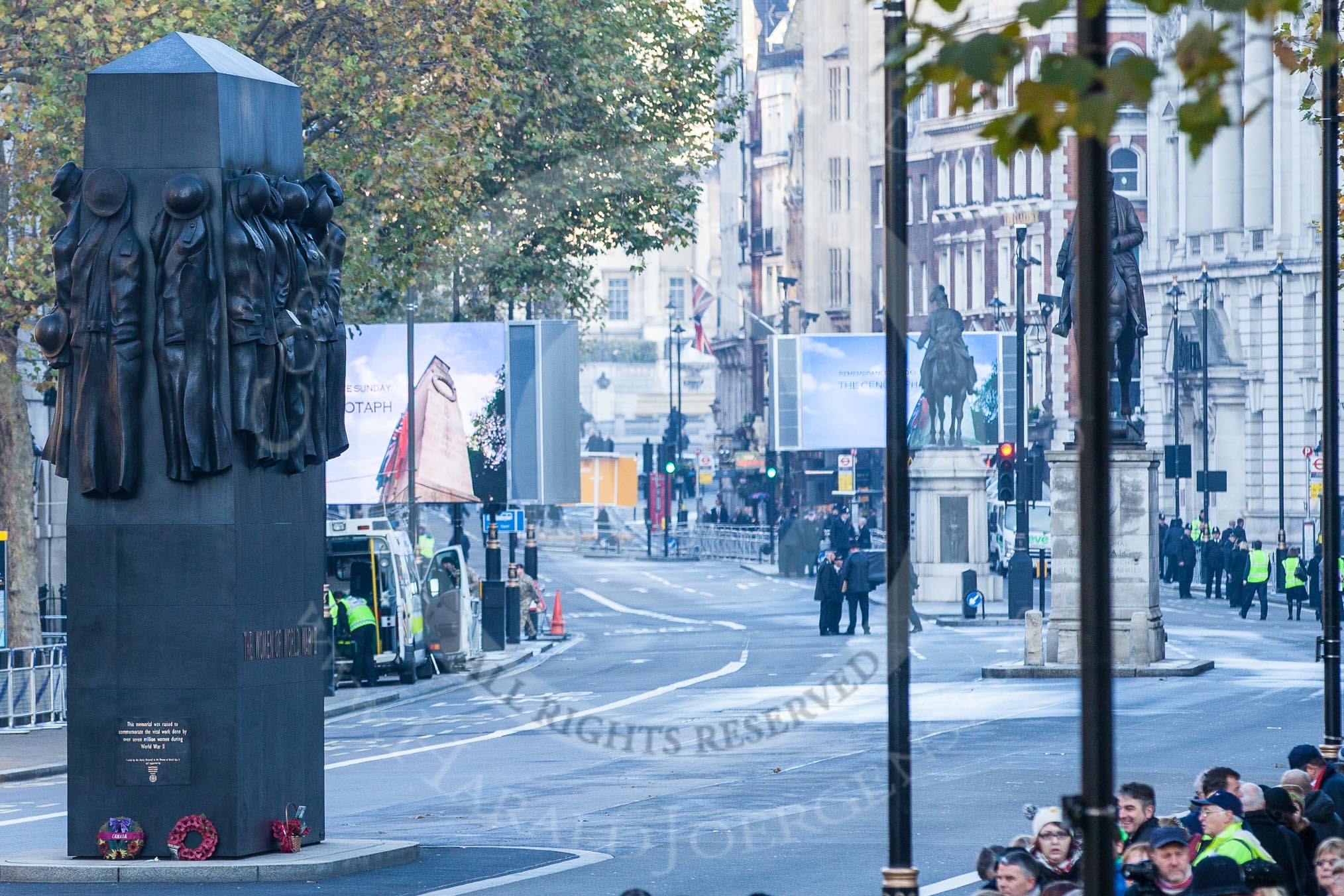 The Women of World War Two Memorial, and behind, at the ed of Whitehall, two big TV screens for public viewing.