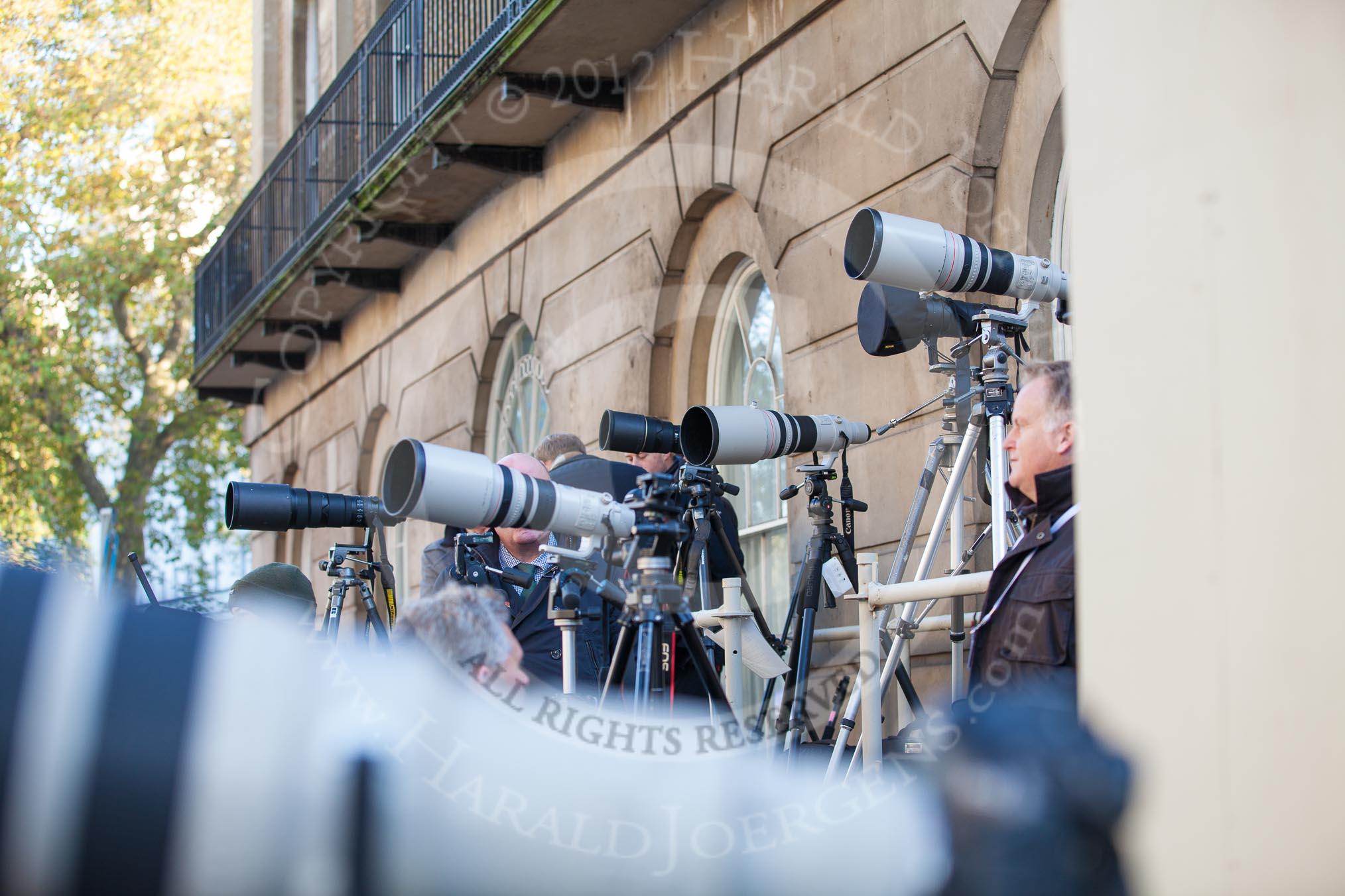 Photographers, cameras, and very long lenses on the media stand opposite the Foreign- and Commonwealth Office Building.