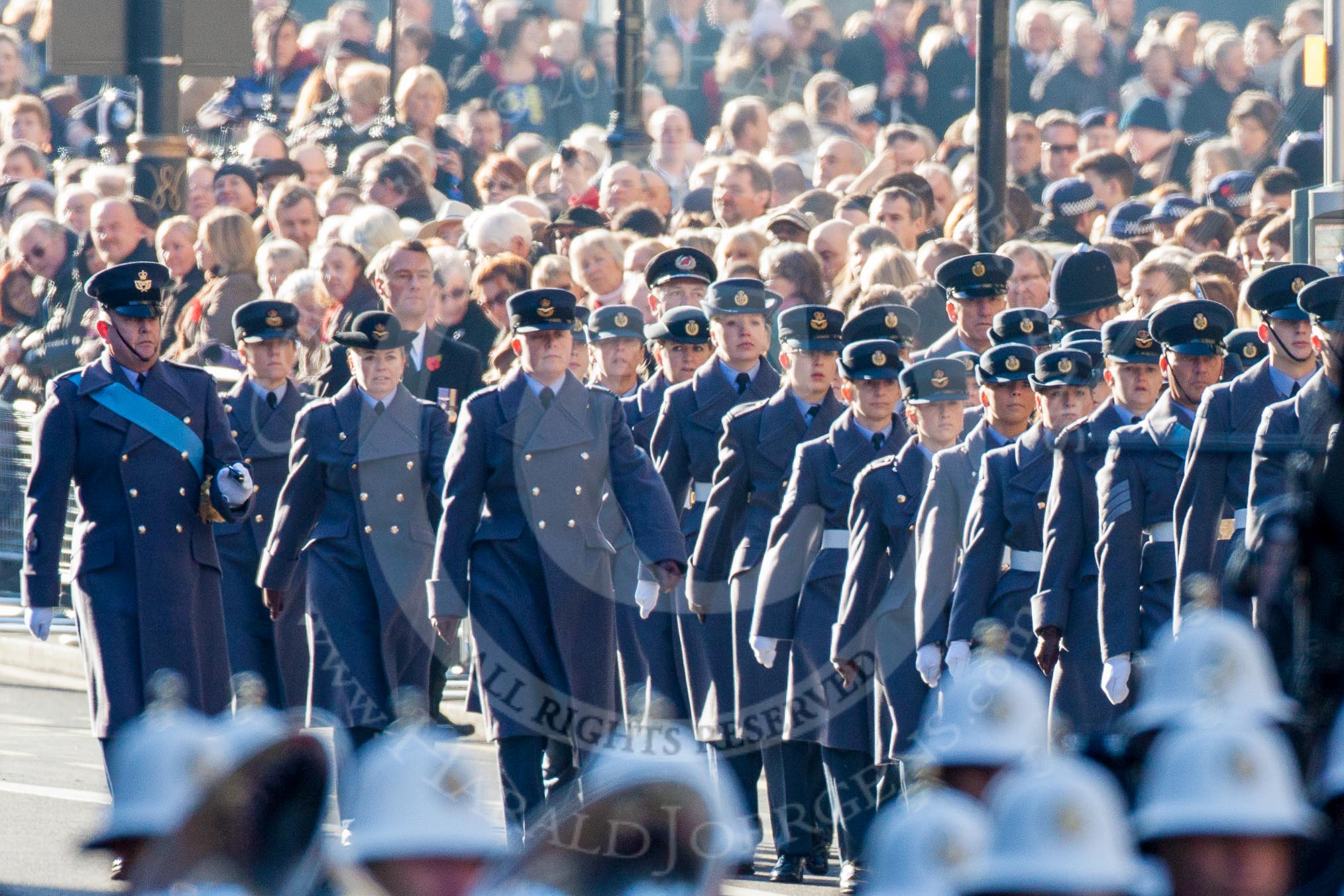 A detachment from the Rotal Air Force following the Central Band of the RAF.